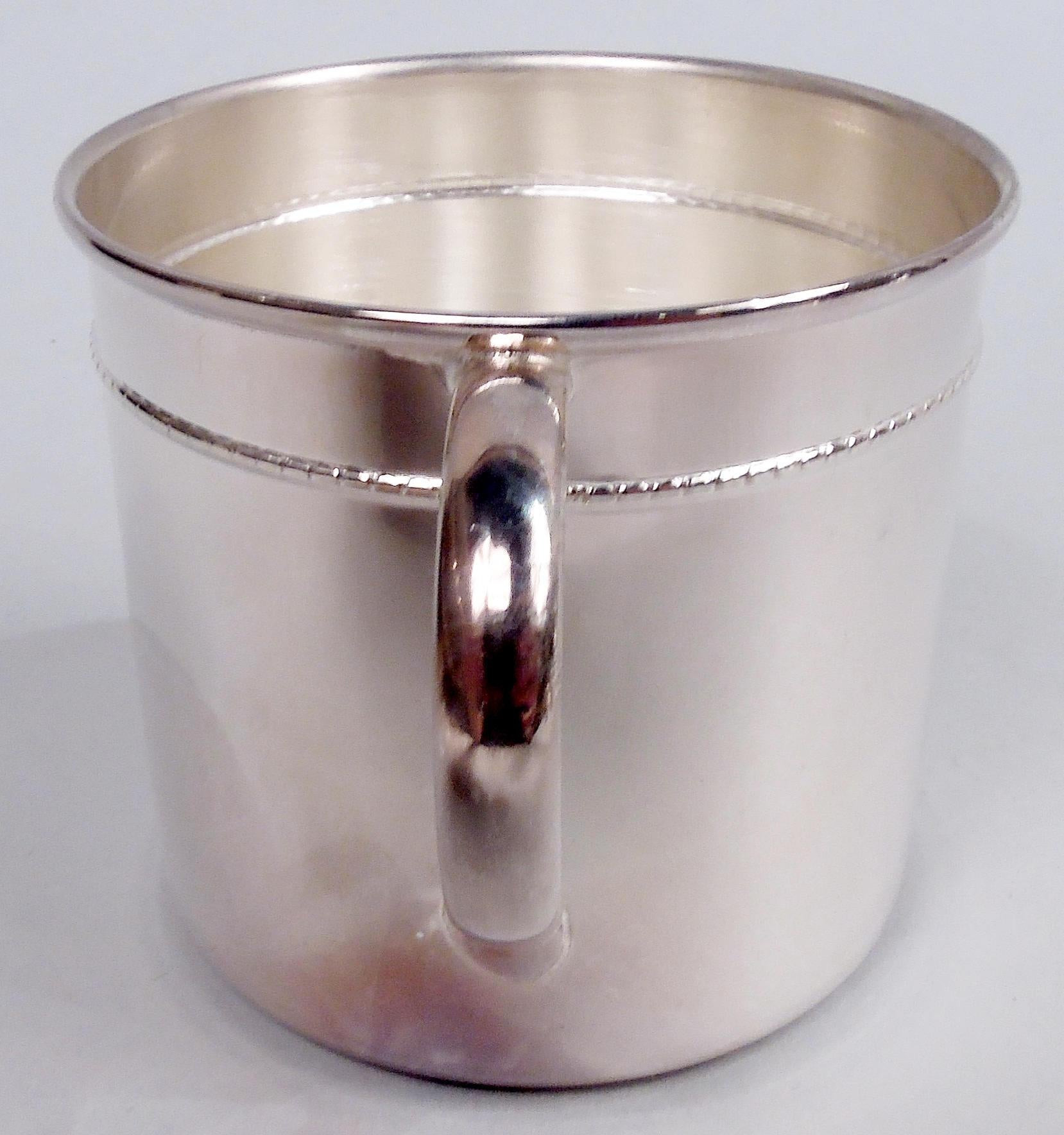 Italian Modern sterling silver baby cup. Drum form with beaded band and c-scroll handle. Plenty of room for engraving. Fully marked including post-1967 maker’s stamp (Rino Greggio). Weight: 1.5 troy ounces. 