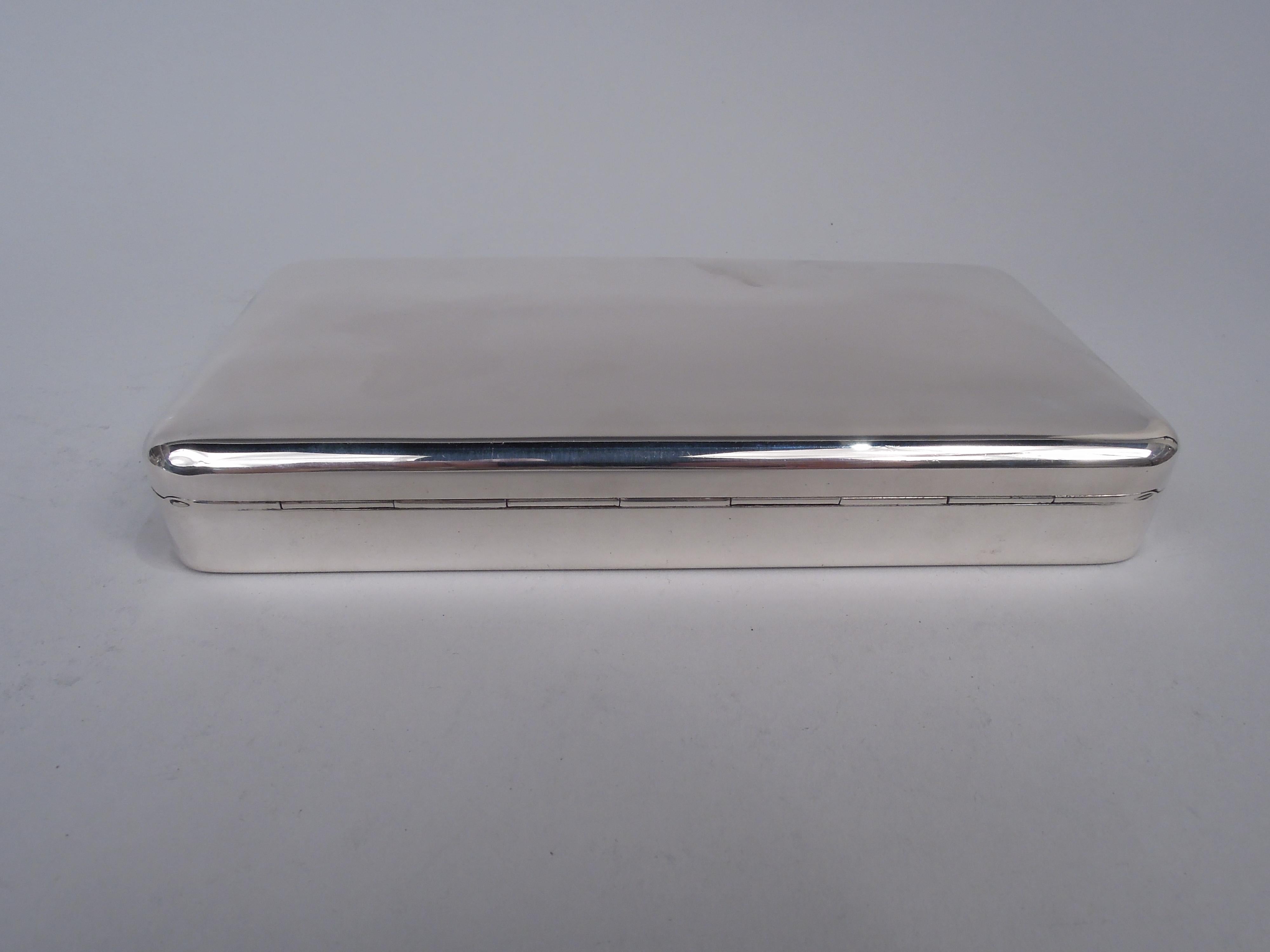 Modern sterling silver box. Rectangular with curved corners. Cover hinged and tabbed with gently curved top. Post-1967 Italian marks including maker’s stamp (Marzi & Pellegrini), and phrases “Hand Made” and “Made in Italy”. Weight: 9.4 troy ounces. 