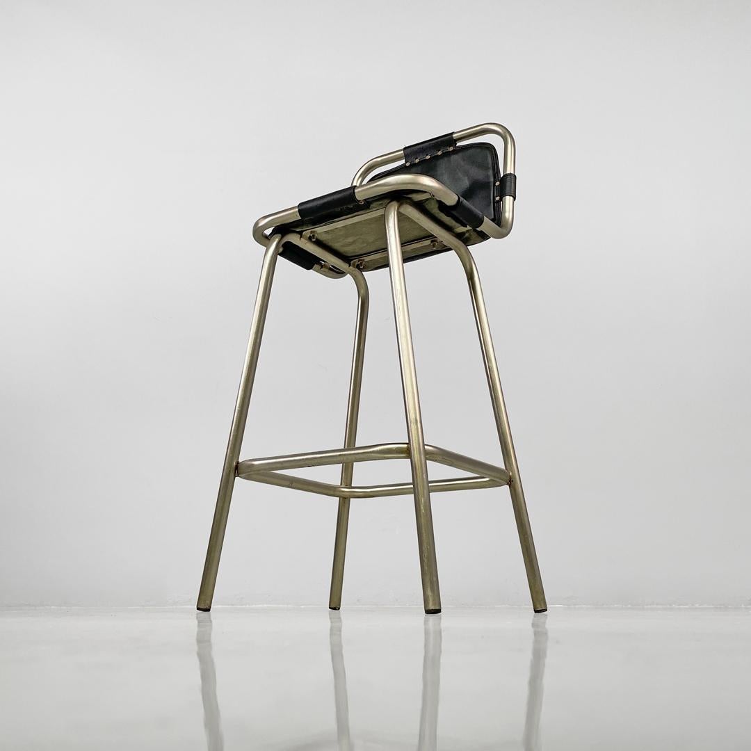 Italian modern stools in metal and black leather, 1970s
Set of four black leather high stools. The frame is metal, while the seat and backrest are upholstered in black leather with black straps.
1970s
Vintage condition, the leather shows scattered