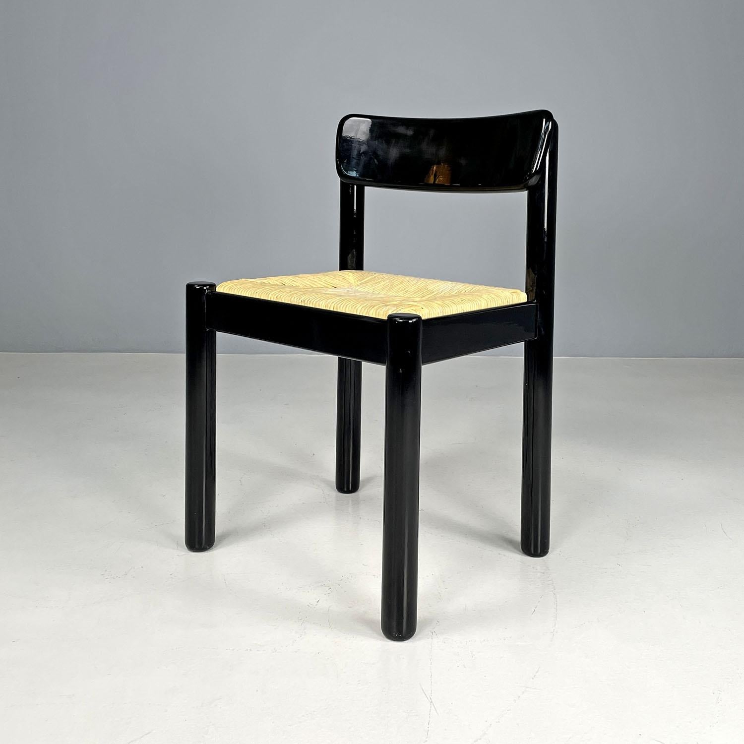 Italian modern straw and black wood chair, 1970s
Chair with rectangular base. The seat is in straw, the structure is in black lacquered wood with a glossy finish. The backrest has a curved and welcoming line. The four legs have a round
