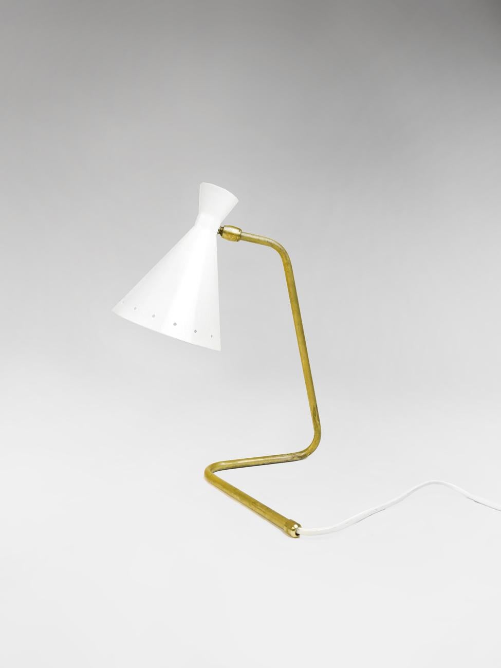 Elegant sculptural table lamp shown in un-lacquered natural brass with ivory shade fabricated in Italy by Fabio Ltd. 

This is a modern, contemporary interpretation of a classic design, strongly influenced by Italian Mid-Century Modernism such as