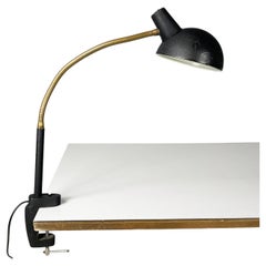 Italian modern table lamp with clamp in black metal and brass, 1970s