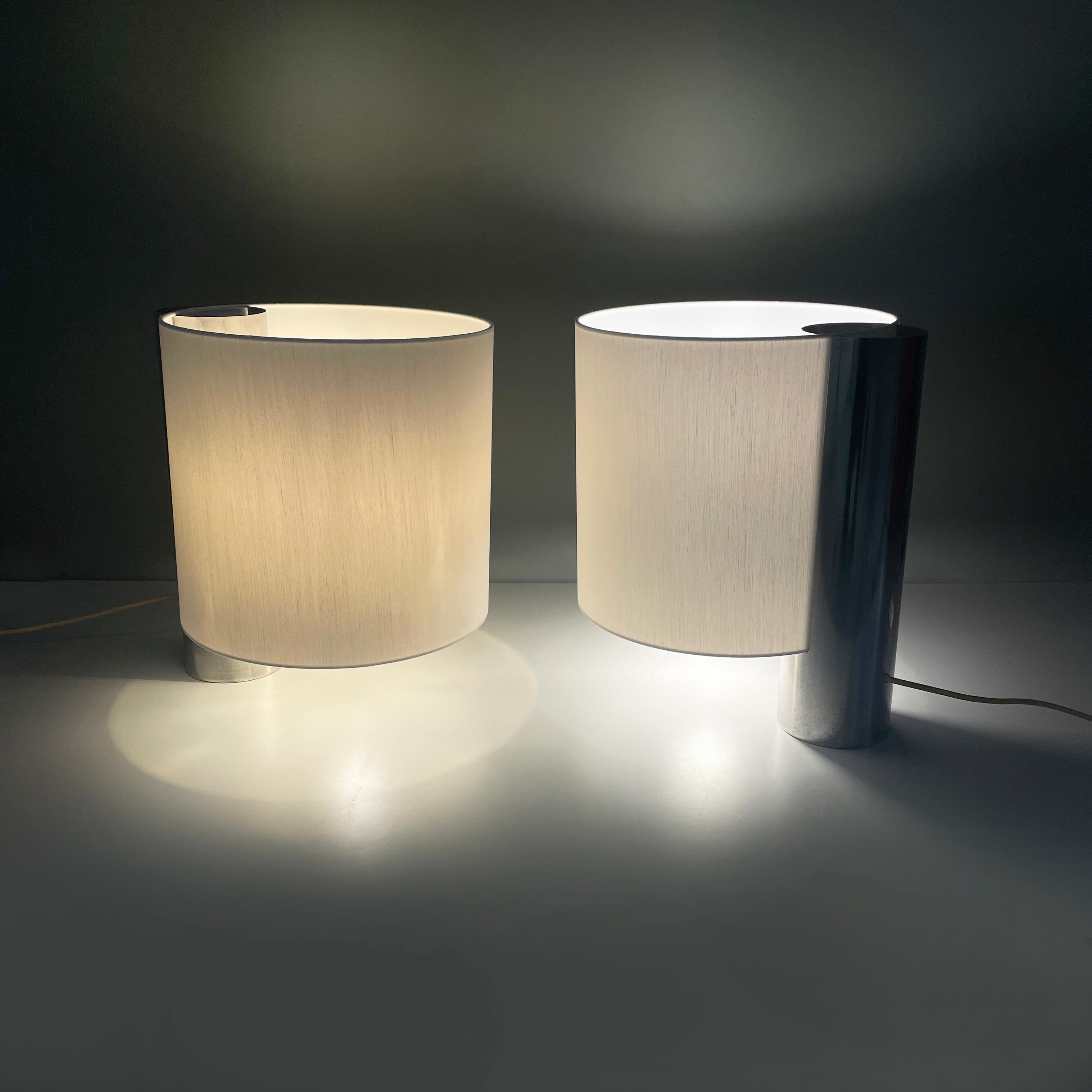 Italian modern Table lamps Fluette by Giuliana Gramigna for Quattrifolio, 1970s
Pair of table lamps mod. Fluette with double bulb and cylindrical lampshade in white fabric. The cylindrical metal structure is positioned along the profile. It has a