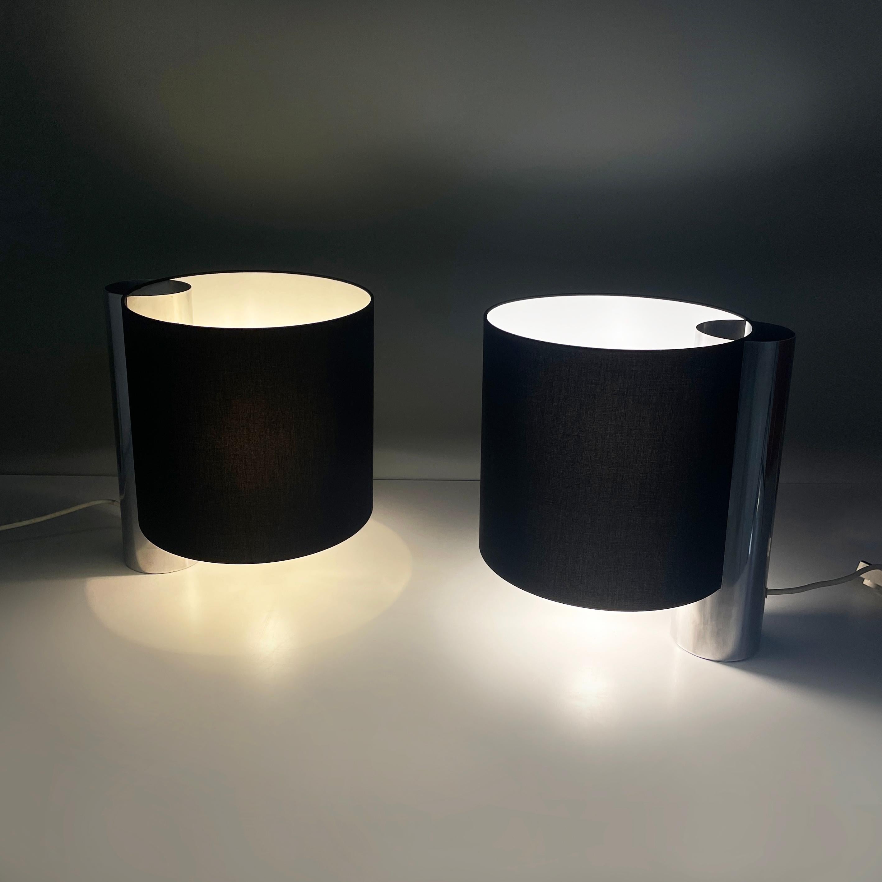 Italian modern Table lamps Fluette by Giuliana Gramigna for Quattrifolio, 1970s
Pair of table lamps mod. Fluette with double bulb and cylindrical lampshade black externally and white internally fabric.The cylindrical metal structure is positioned