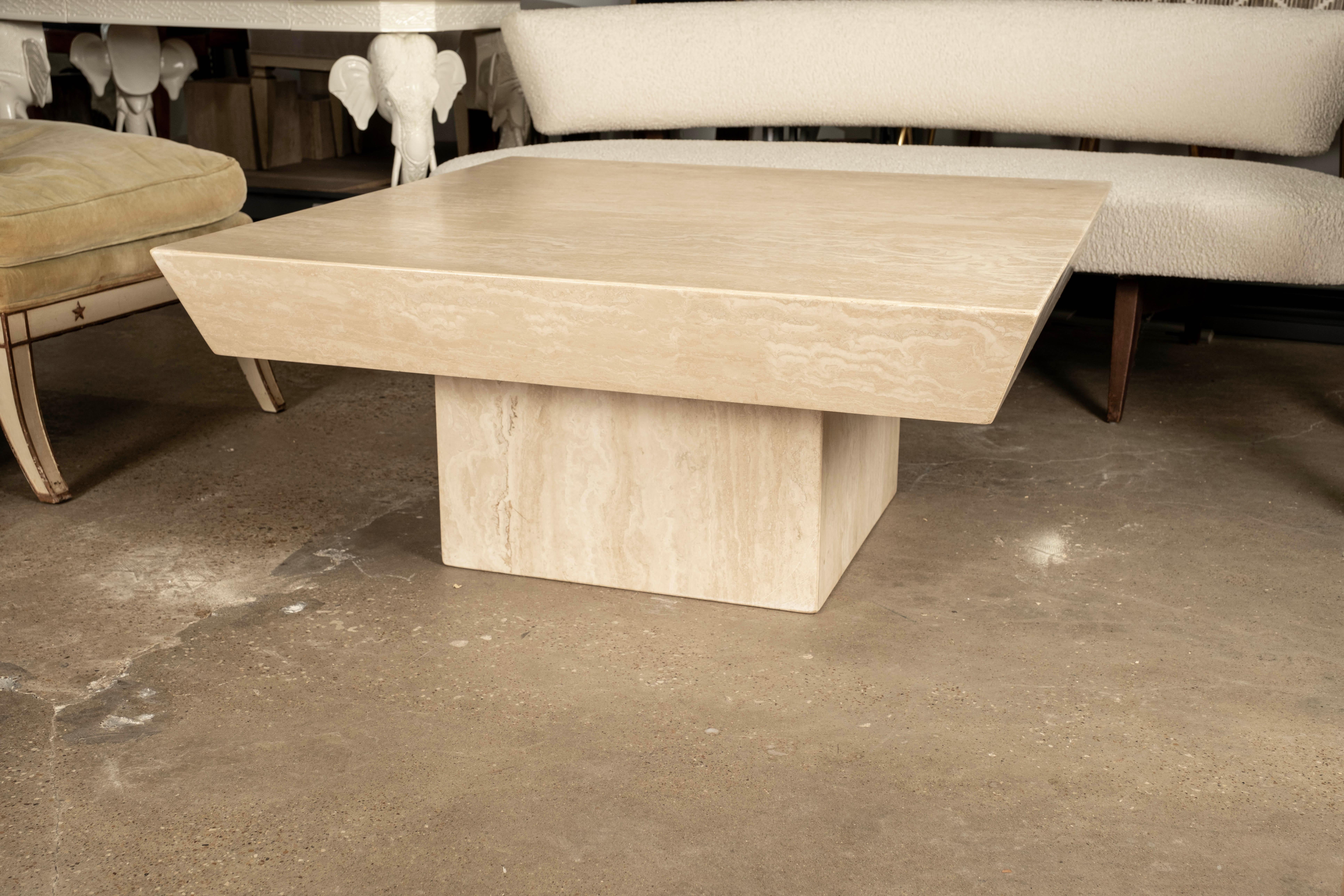 Italian Modern Travertine Coffee Table Attributed To Angelo Mangiarotti.
This shapely designed Italian Postmodern square honed travertine cocktail table appears to be floating.
It comes in two pieces: the base and the interestingly cut