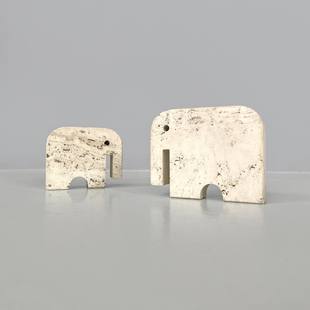 Italian modern travertine sculptures by Enzo Mari for Fratelli Mannelli, 1970s
Pair of travertine sculptures. The two sculptures are in the shape of an elephant and are of two different sizes, the lines of the cuts are geometric and essential,