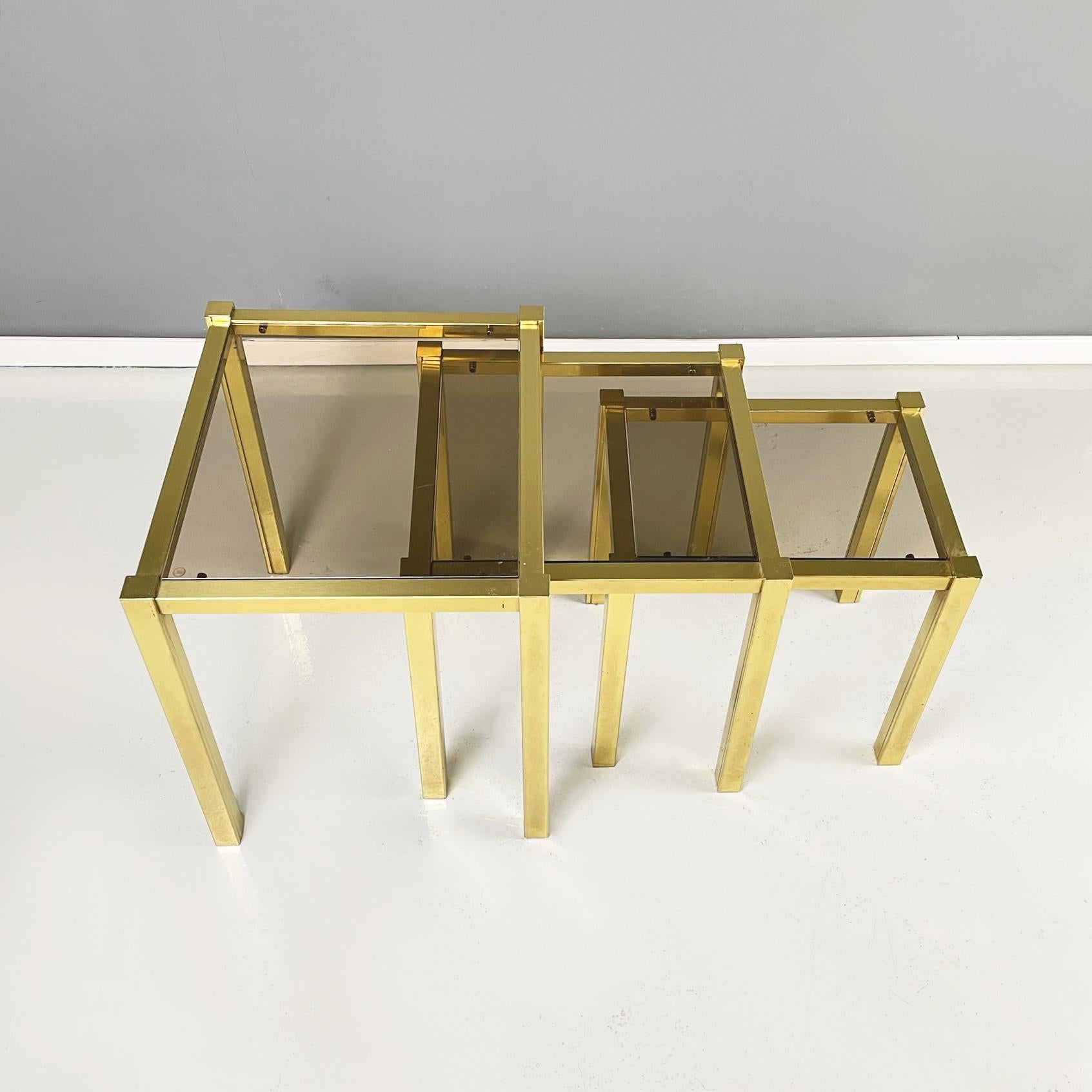 Late 20th Century Italian Modern Trio of coffee Tables in Brass and Smoked Glass, 1970s For Sale