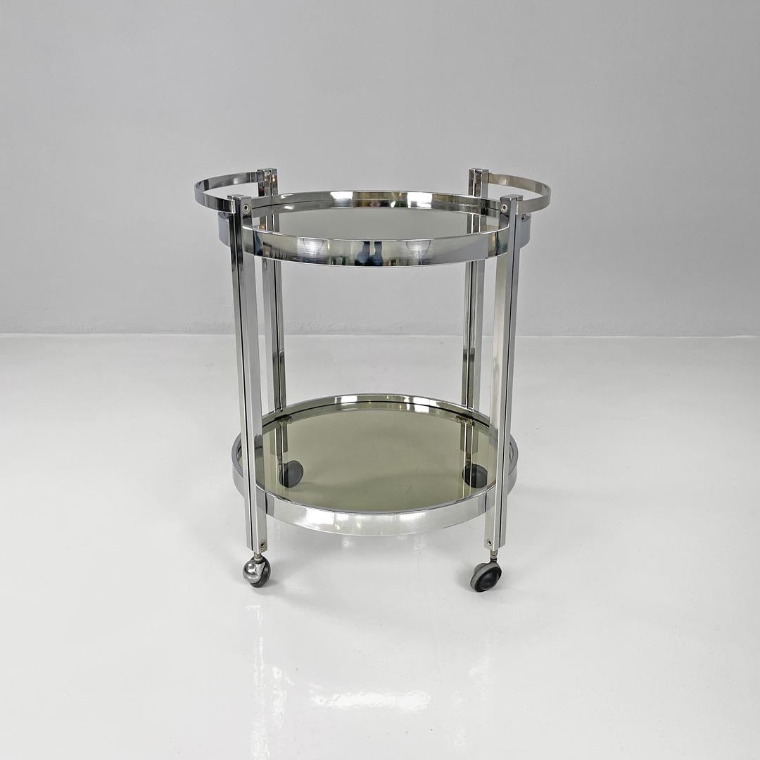 Metal Italian modern two tops chromed metal and smoked glass cart with wheels, 1970s For Sale