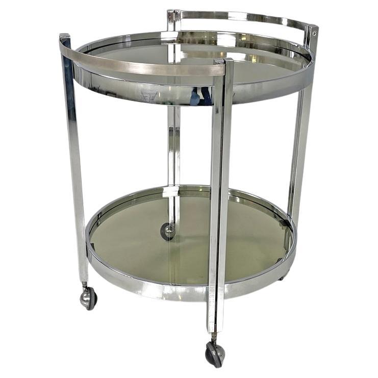 Italian modern two tops chromed metal and smoked glass cart with wheels, 1970s For Sale