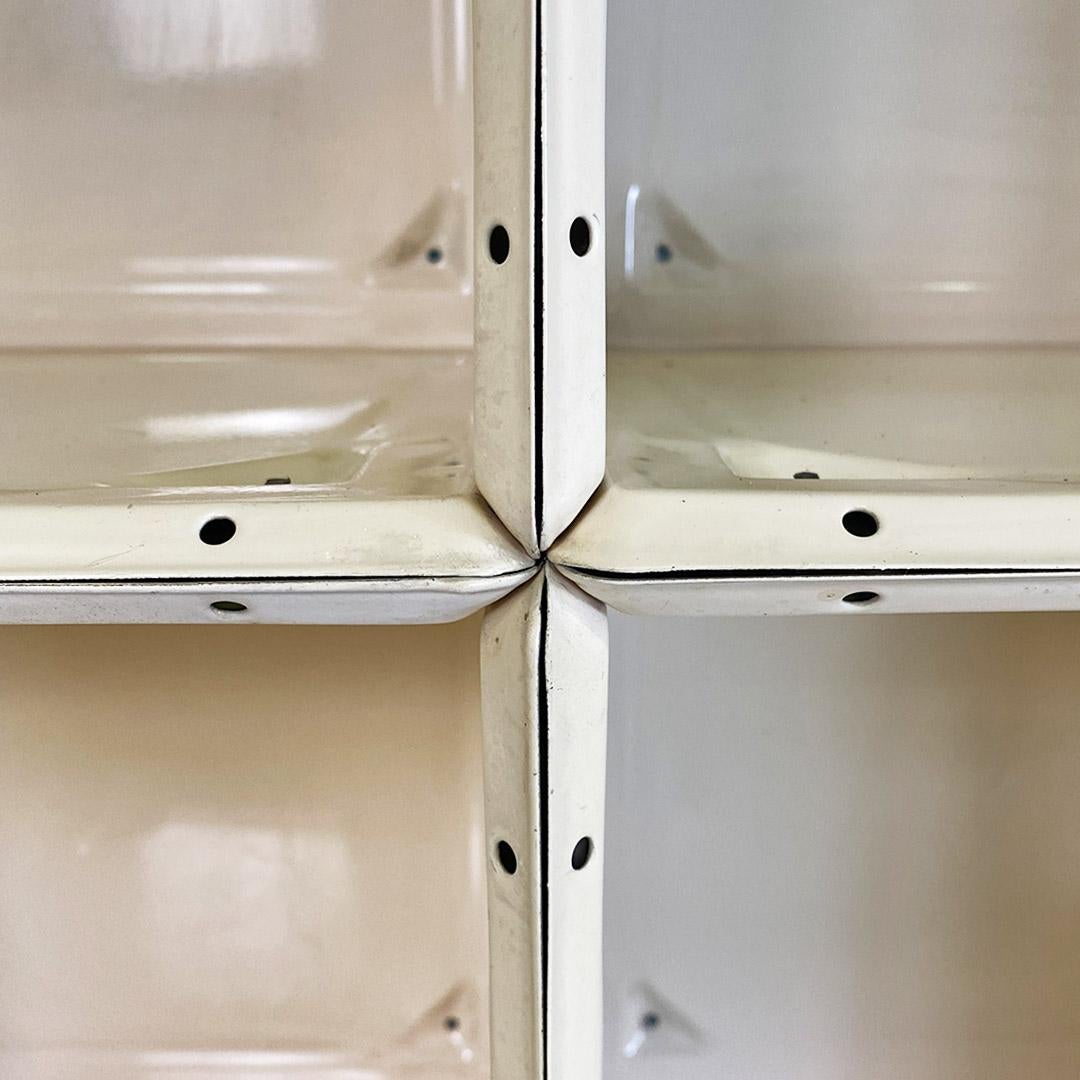 Late 20th Century Italian modern very solid dirty white metal sel-supporting bookcase, 1970s For Sale