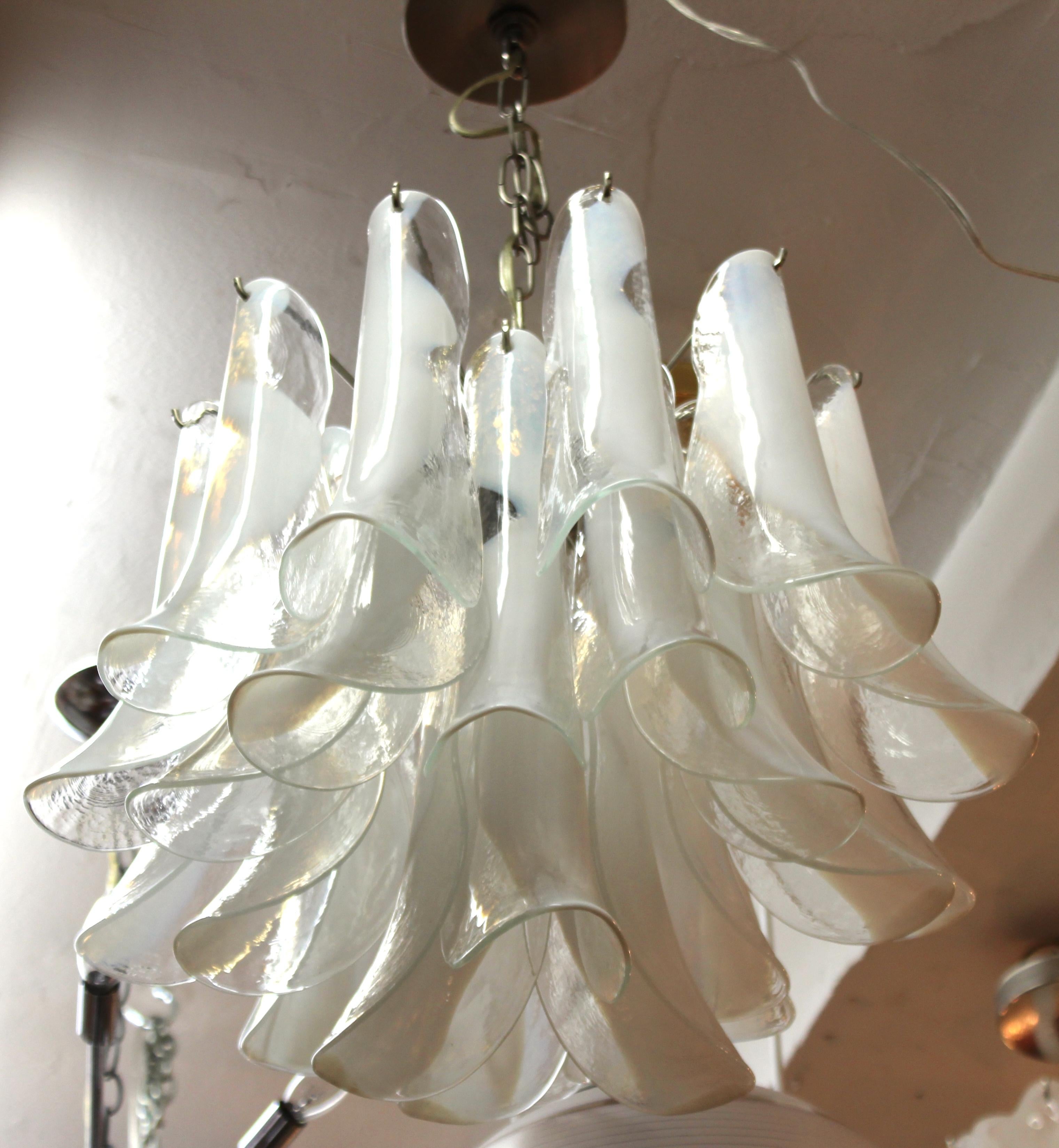 Italian modern handkerchief chandelier made with multiple concentric layers of delicately folded glass elements in white and clear glass. The piece was made in Italy during the 1970s and is in great vintage condition.