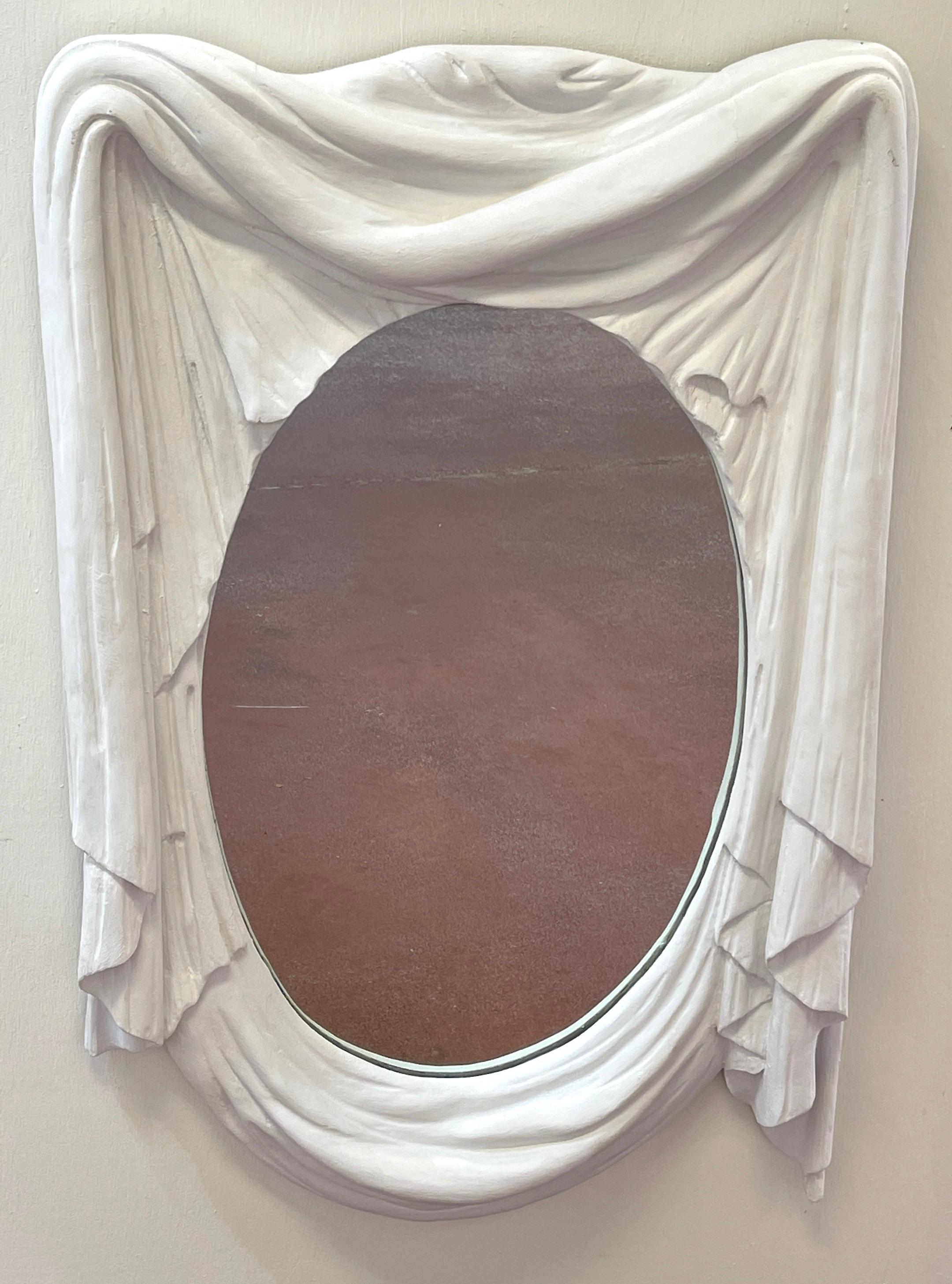 Italian modern white lacquered carved wood draped mirror
Beautifully executed, realistically carved and lacquered in white. Influences of John Dickenson.
The inset mirror measures 19