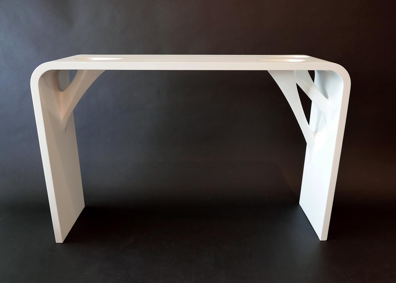 Rare pair prototype tables by L'opere e i Giorni. Signed to bottom 2015, top side and edge is white matte lacquer and underside is gloss white lacquer- these table have a sculptural quality and relate to work by the architect Zaha Hadid.