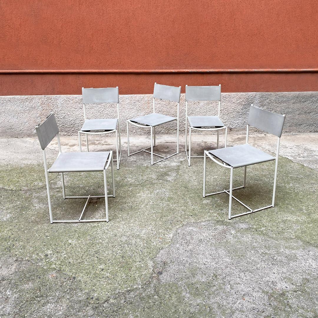 Italian modern set of rare white metal and light grey leather dining chairs by Giandomenico Belotti for Alias, 1979.
Set of five Spaghetti chairs with structure in white metal rod and seat in light gray leather. Curved handle behind the backrest