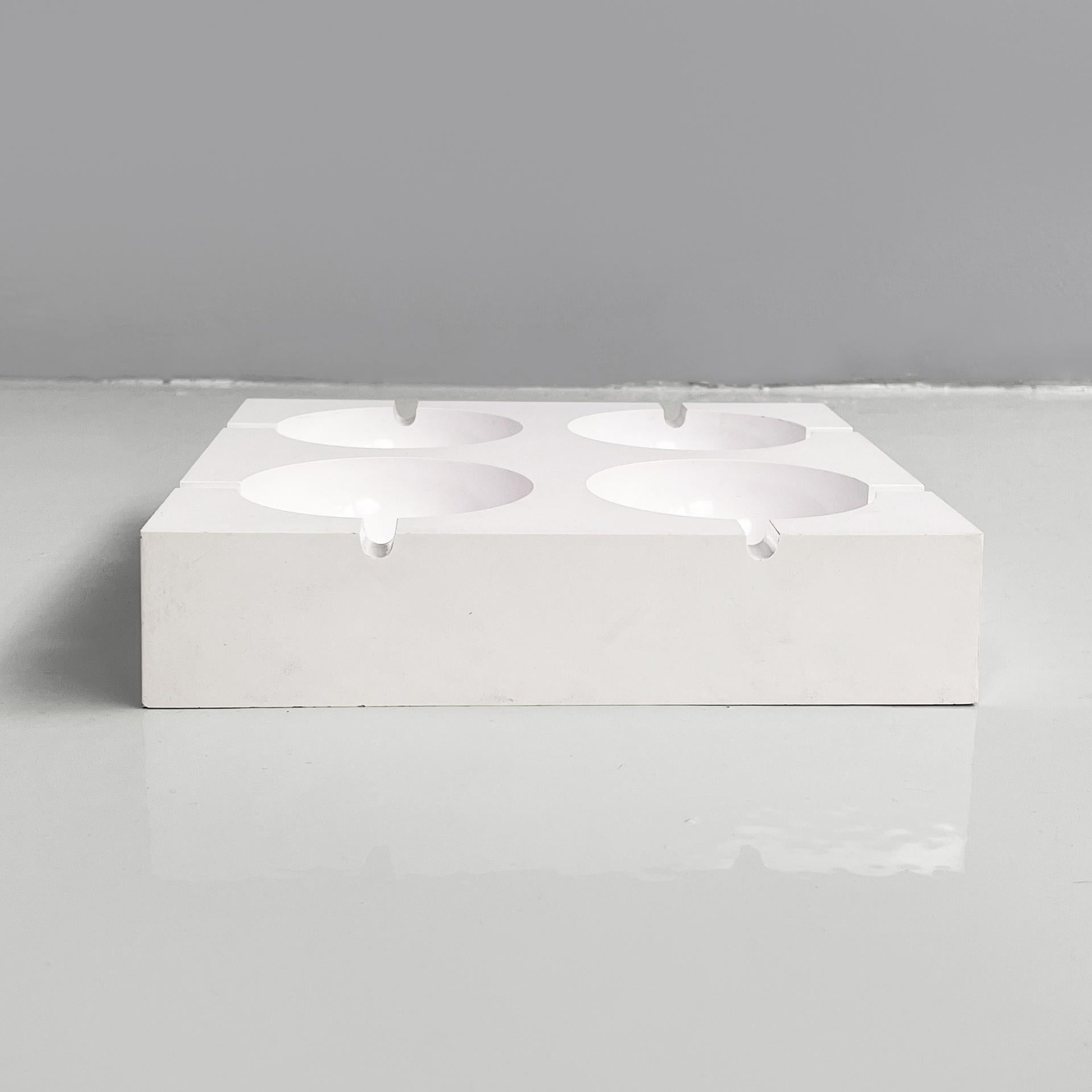 Italian modern white plastic ashtray by Giorgio Soavi for Olivetti, 1960s
Ashtray with a square base in white plastic. It has four semi-spherical compartments and each has two cigarette rests. It can be used as a pocket emptier or a small