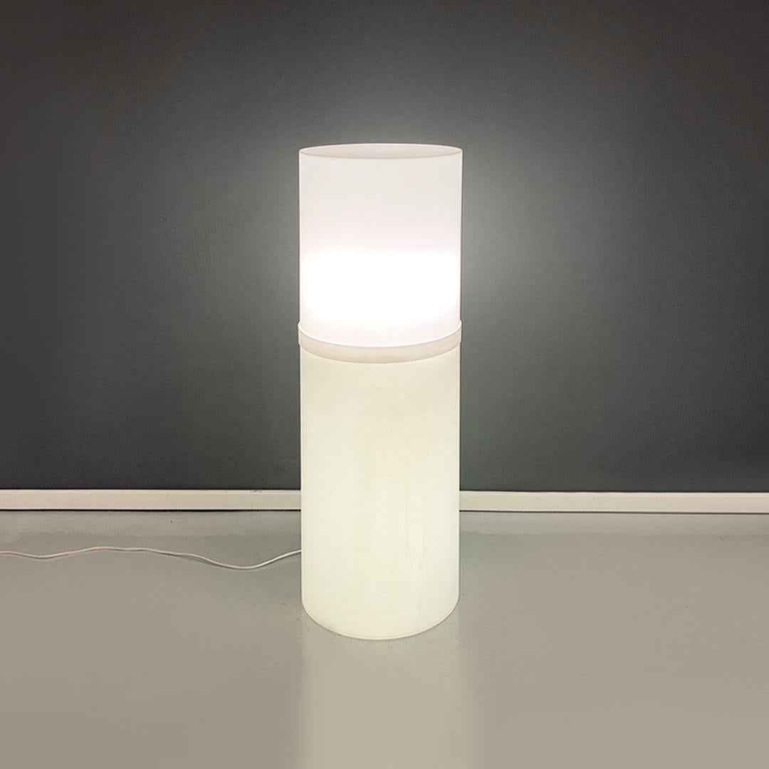 Italian modern white plastic floor lamp, 1970s
Floor lamp in white plastic, composed of two cylindrical modules of different heights that fit one on top of the other to form a single cylindrical structure and contain neon lights inside, with the