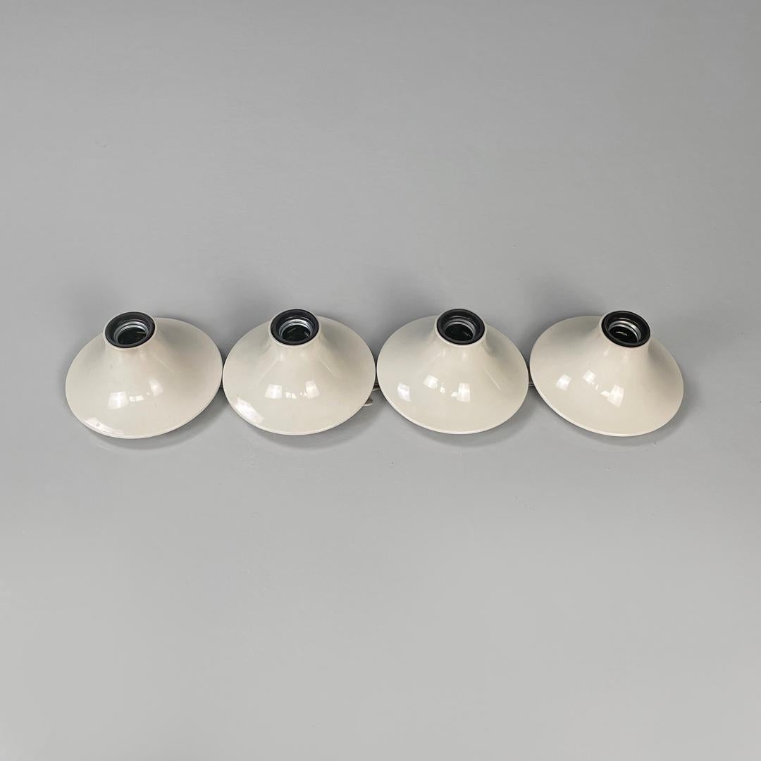 Italian modern white plastic wall lamps Teti Vico Magistretti for Artemide 1970s
Set of four wall lamps mod. Teti with round base in white plastic with black plastic interior. The structure tends to widen towards the base and narrow towards the