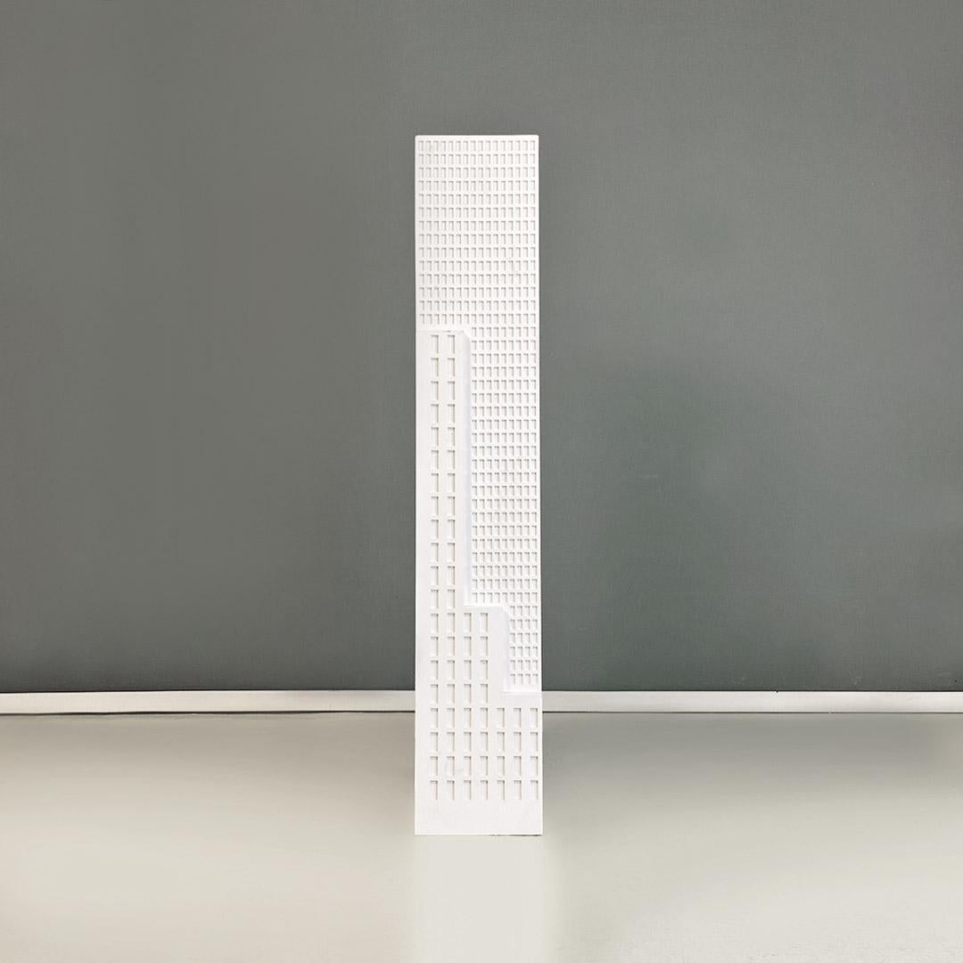 Italian modern white wooden skyscraper pedestal or display stand produced in the 2000s.
Pedestal or display in the shape of a skyscraper, with a structure entirely of mdf in white color with a square base.
Made in 2000 approx.
Good general