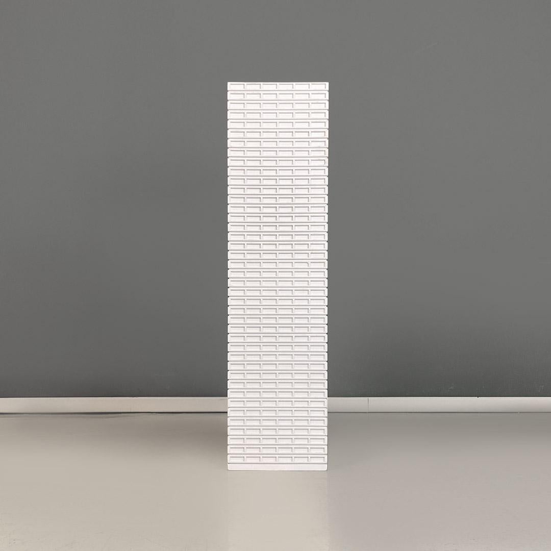 Italian modern white wooden skyscraper pedestal or display stand produced in the 2000s.
Pedestal or display stand in the shape of a skyscraper, with structure entirely in white mdf with a rectangular base.
Made in 2000 approx.
Good general