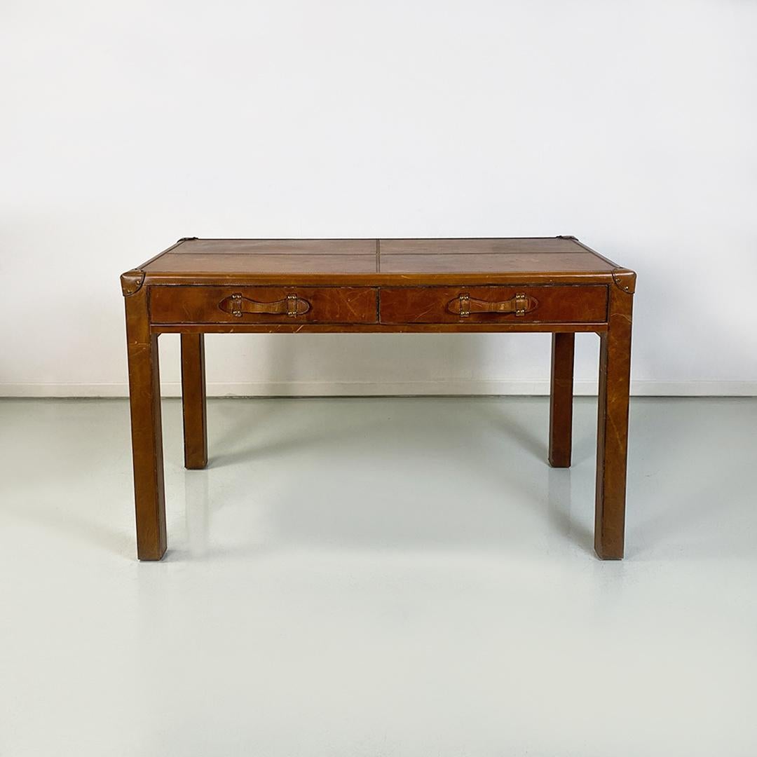 Italian modern wood and leather table similar to the leather suitcases, 1970s
Dining table entirely covered in leather, with a design similar to the leather suitcases of the first half of the twentieth century. Four-legged structure with square