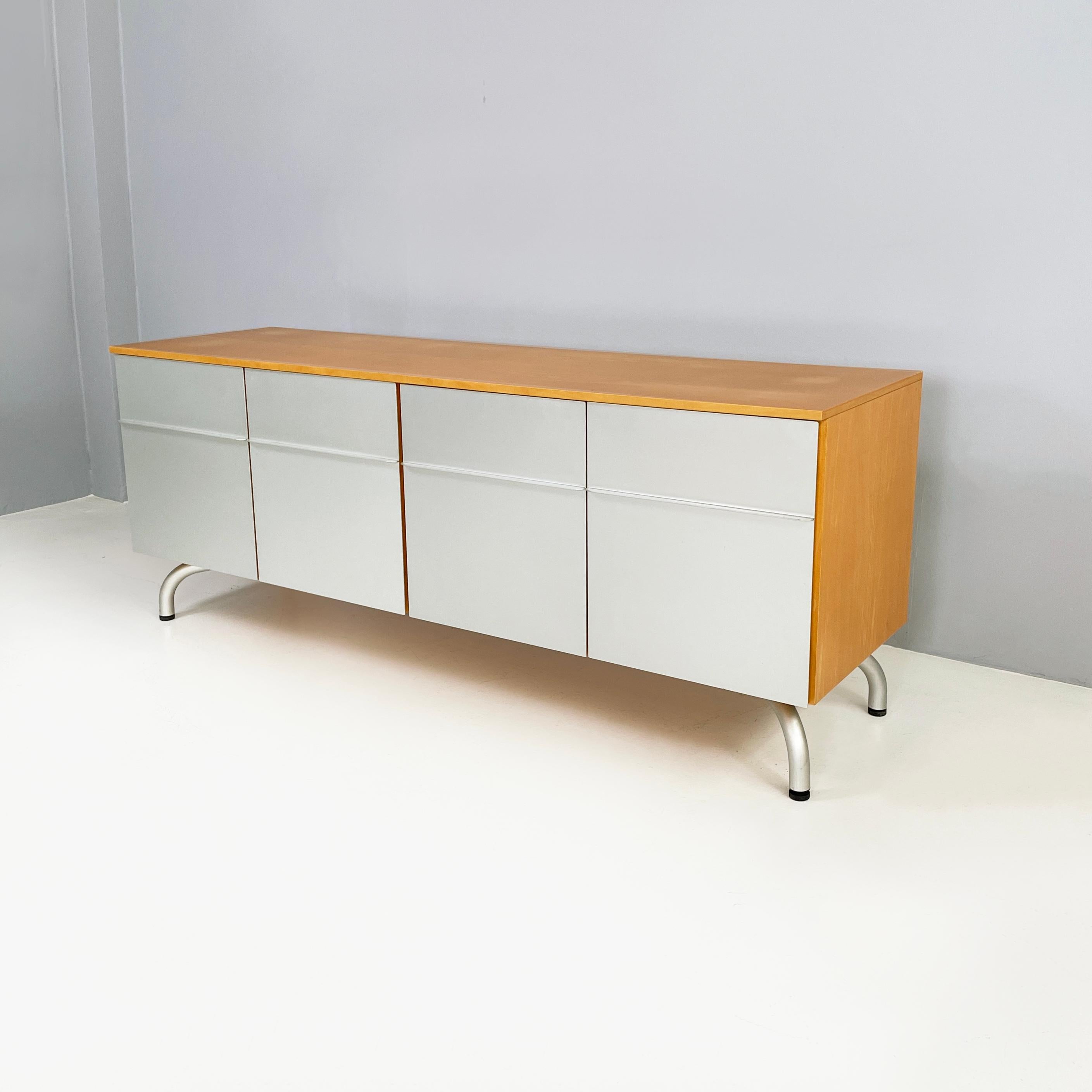 Italian modern wood and metal sideboard by Vico Magistretti for De Padova, 1980s
Rectangular base sideboard with wooden structure. On the front it features a pair of double metal doors. In each compartment there is a wooden shelf. Round metal legs