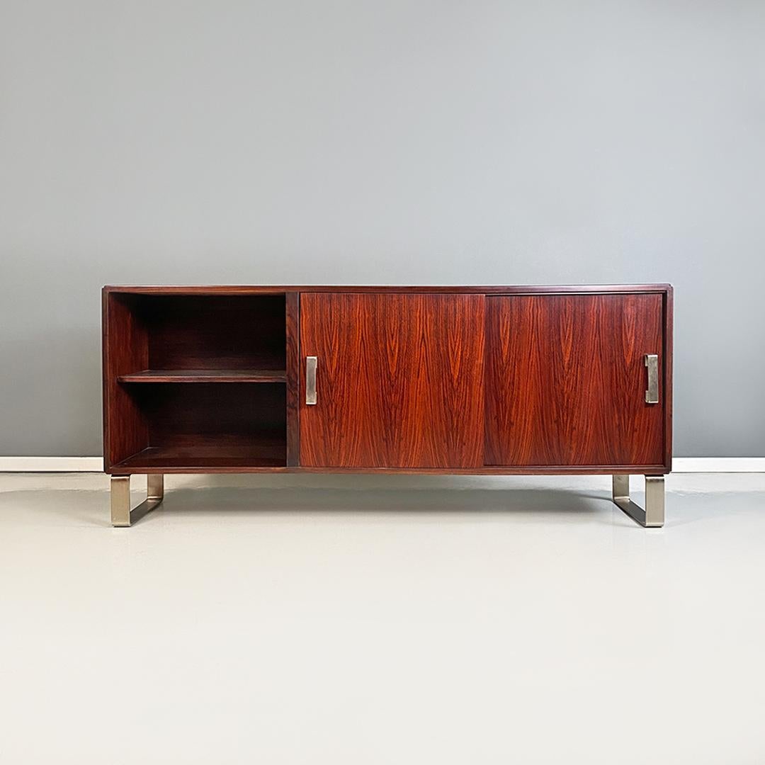 Italian modern solid wood and satin steel sideboard by Giulio Moscatelli for Formanova, 1970s.
Sideboard in solid wood, with legs and handles in satin steel, with double sliding door and open compartment.
Designed by Giulio Moscatelli for