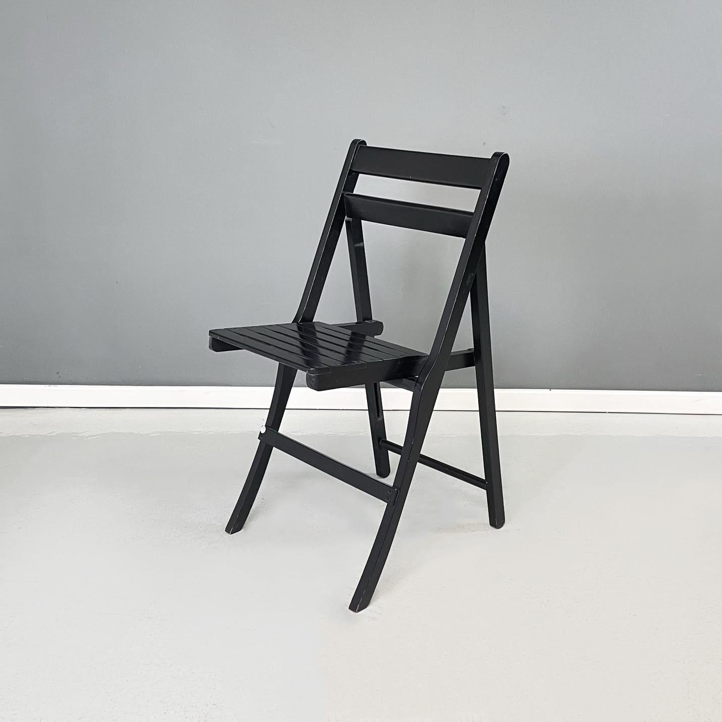 Italian modern Wood folding chair Morettina by Ettore Moretti for Zanotta, 1970s
Folding chair mod. Morettina in black painted wood. The backrest and seat is made up of a series of slats.
Produced by Zanotta in 1970s and designed by Ettore Moretti.