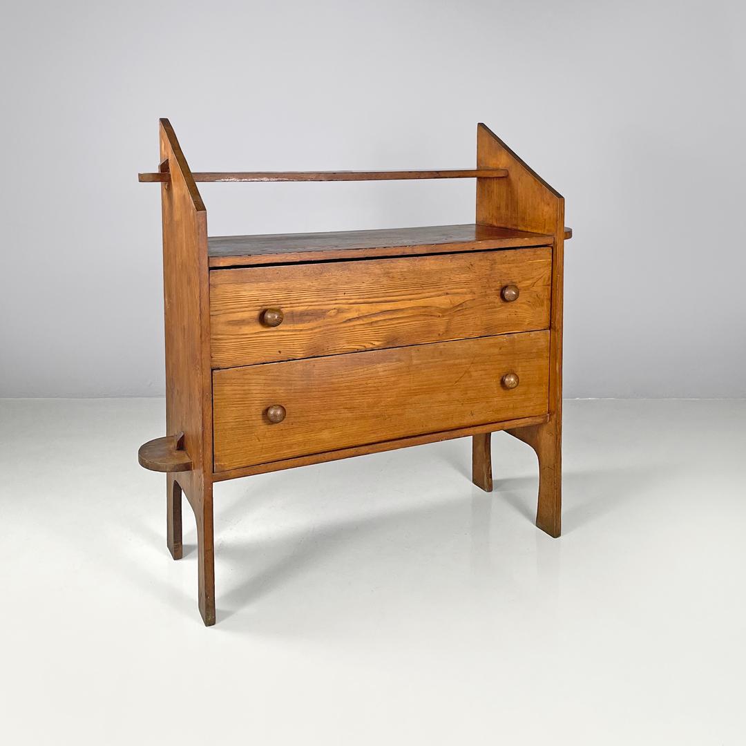 Italian modern wooden chest of drawers with visible joints La Casa Bella, 1970s
Chest of drawers entirely made of wood with two drawers. The shelves are made of wooden beams that fit together, the part of the joint is visible on the sides of the