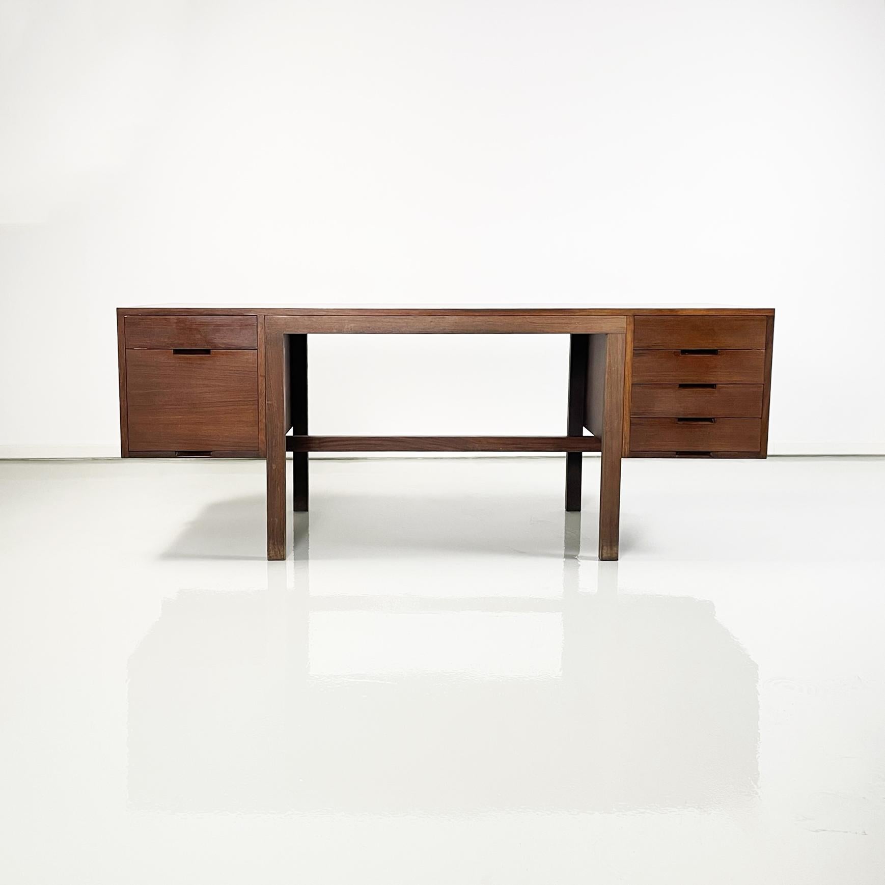 Italian modern Wooden desk mod. Canaan by Marcel Breuer for  Gavina, 1970s
Desk mod. Canaan with rectangular wooden top. On one side there are 2 drawers and on the other 4. It has a wooden crossbar in the lower part, which can be used to rest the