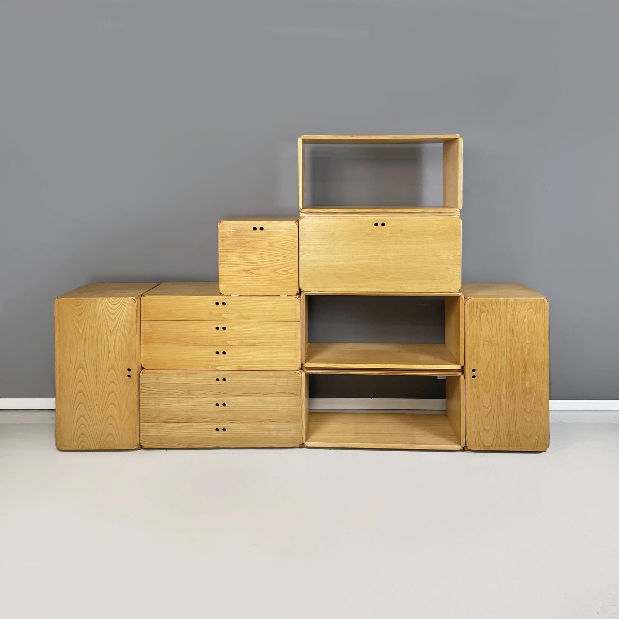 Italian modern Wooden modular bookcase or sideboard by Derk Jan De Vries, 1980s
Modular bookcase or storage-sideboard in light colored wood. The bookcase includes 9 modules with rounded corners. 2 rectangular modules with hinged door, 2 rectangular