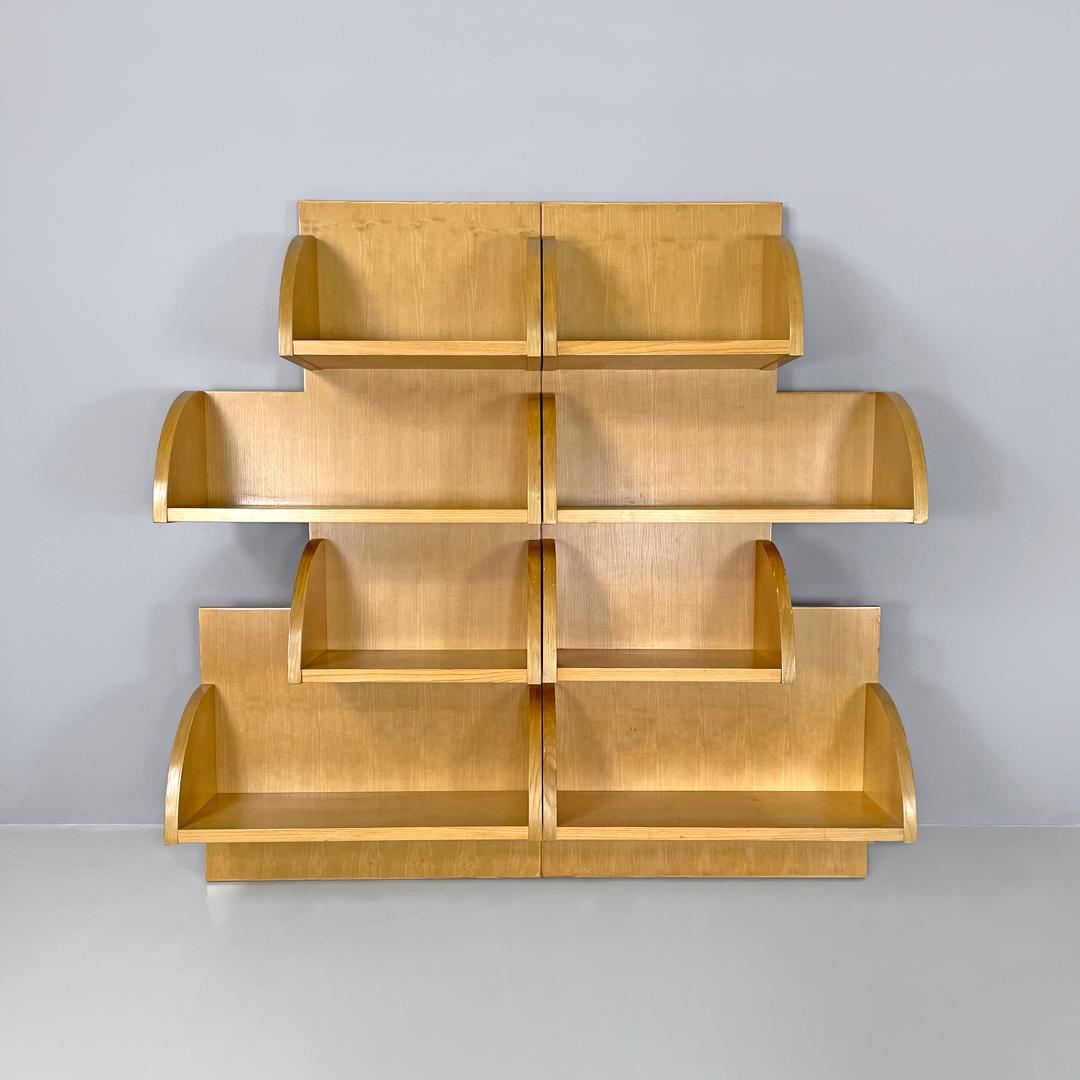 Dutch modern wood wall bookcase by Derk Jan De Vries with rounded shelves, 1980s
Rectangular wooden wall bookcase. The bookcase is made up of two rectangular panels that are joined together using wooden dowels. The eight shelves can be arranged