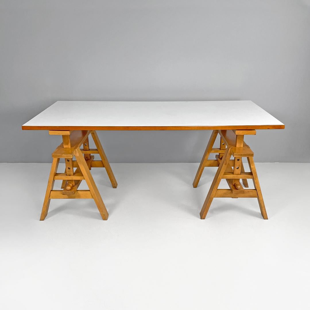 Italian modern working table Leonardo by Achille Castiglioni for Zanotta, 1970s
Desk, work table or dining table mod. Leonardo in wood. The rectangular top is covered in white laminate, on two sides it has a homogeneous finish while on the other two