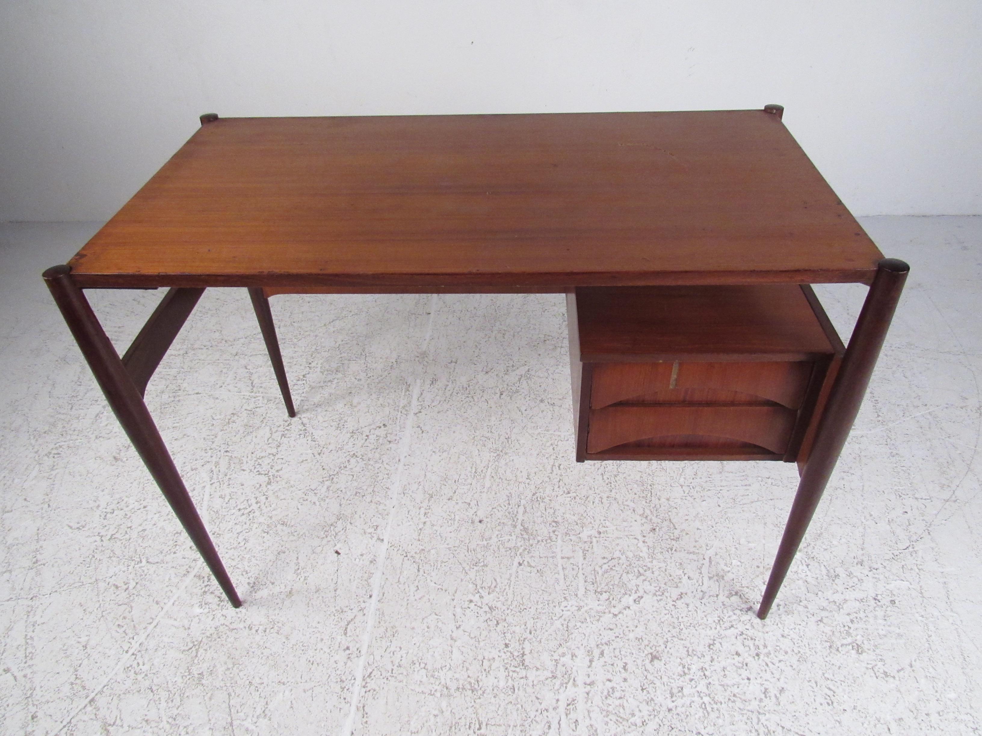 Beautiful two-layer Italian writing desk. This piece features abstract lines with full functionality. It brings a minimalist approach to office design while maintaining full practicality. This is a beautiful piece for any modern space. Please