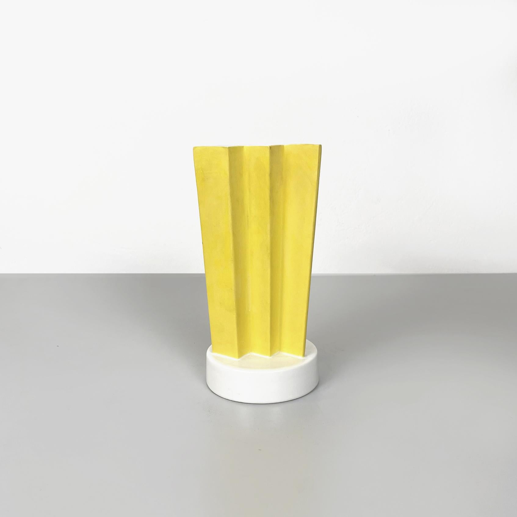 Italian modern yellow ceramic Vase ET1 by Ettore Sottsass for A. Sarri, 1990s
Rare and elegant vase mod. ET1 with round base in ceramic painted in yellow and glazed in white. The structure is composed of a semi-round shaped part and a zig-zag part.