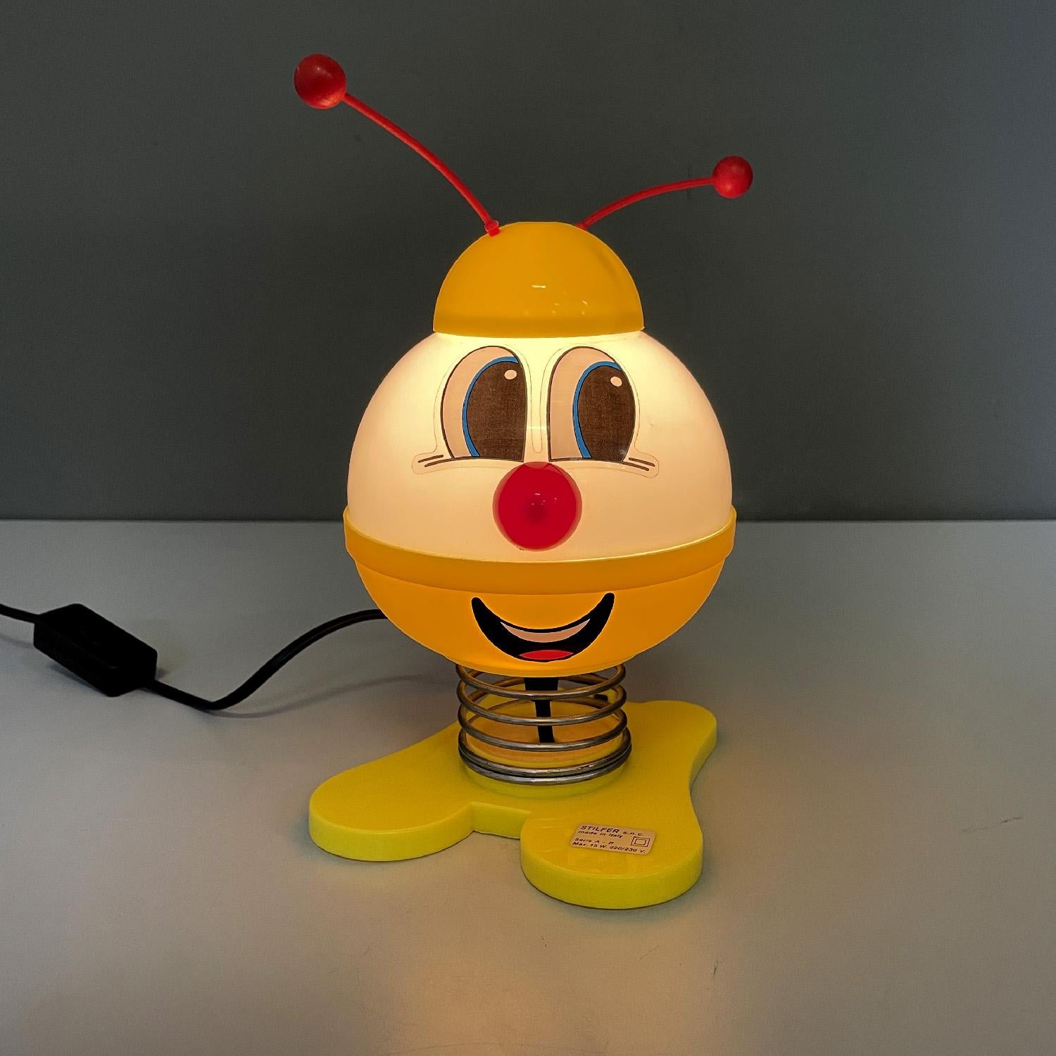 Italian modern table lamp Robot by Stilfer Milano, 1970s
Table lamp mod. Robot representing a cute character. The speaker is also the character's head and is made of white plastic, with painted eyes and mouth while the nose and antennas are red and