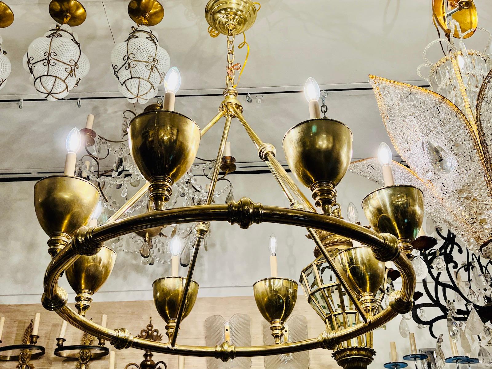 A circa 1960’s Italian polished bronze chandelier.

Measurements:
Current drop: 44?
Diameter: 33?