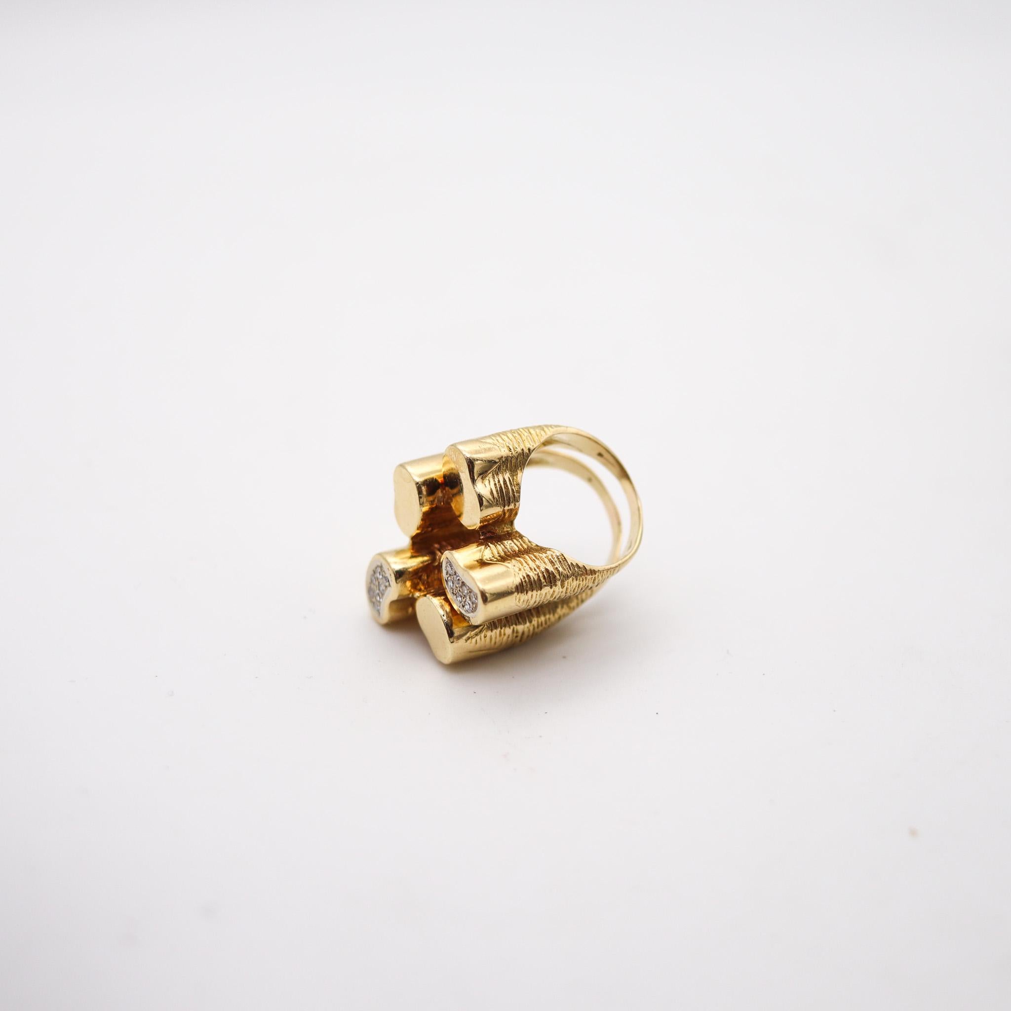 A sculptural Italian cocktail ring.

An statement cocktail ring, created in Italy with sculptural volumetric patterns, back in the 1970. Crafted in levels, with five free form volumes made up in solid yellow gold of 18 karats with textured and