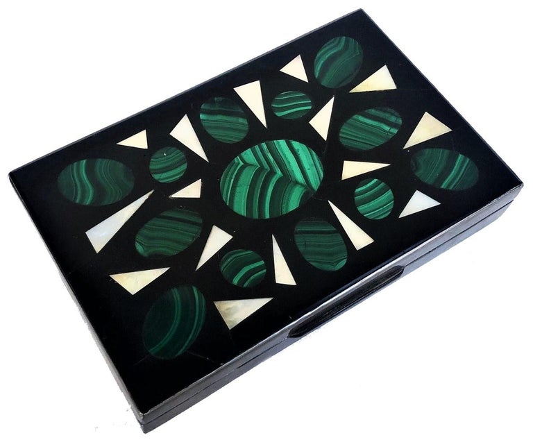 ABOUT BOX
This unusual, finely handcrafted tabletop box most likely was intended to hold money. It unmistakable appearance immediately evokes the distinctive mid-20th century Italian modernist style - a combination of refined simplicity and luxury