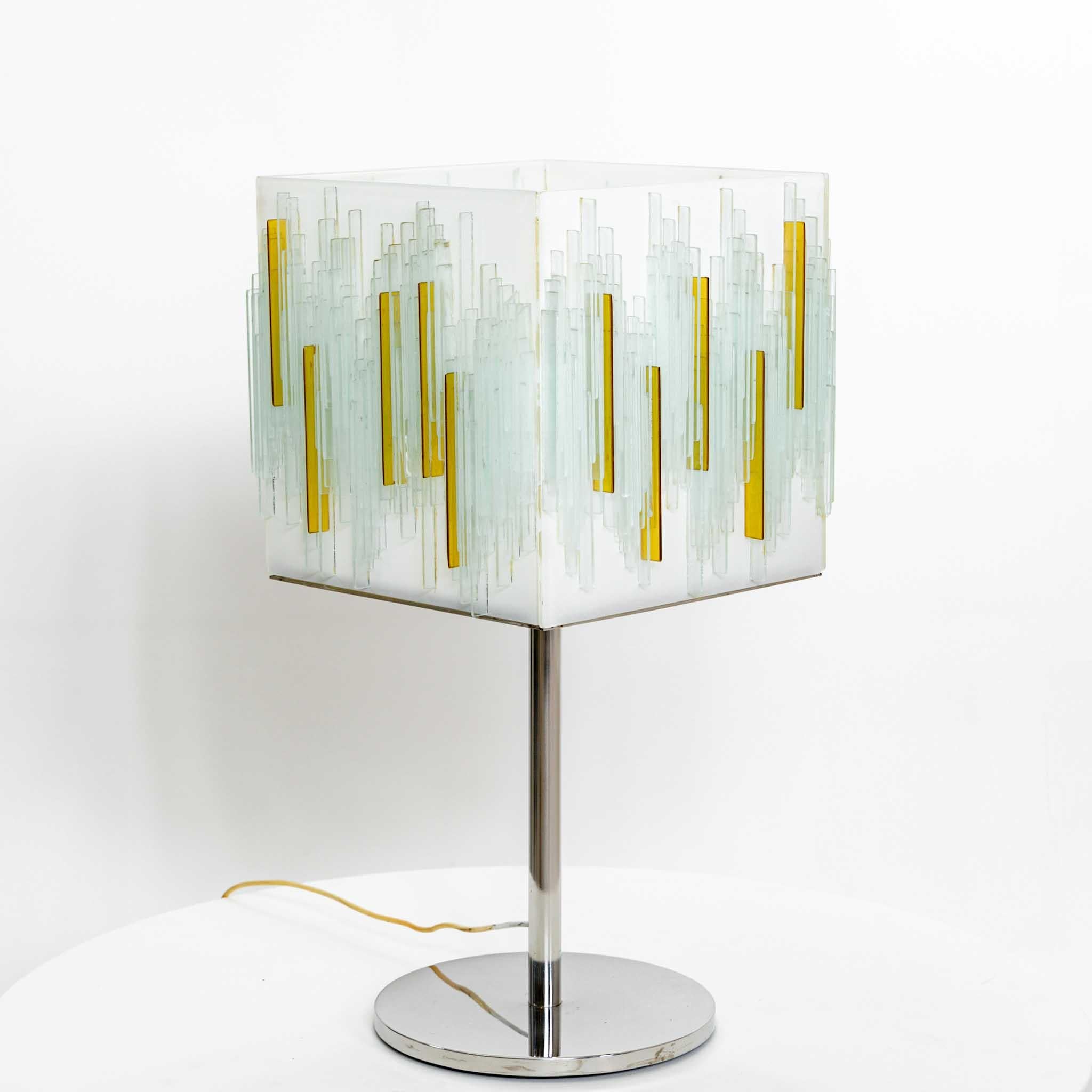 Italian Modernist Art Glass table lamp. 
Heavy Art Glass shade resting on a chromed metal base. 
Glass shade has age and some small chips and fractures.