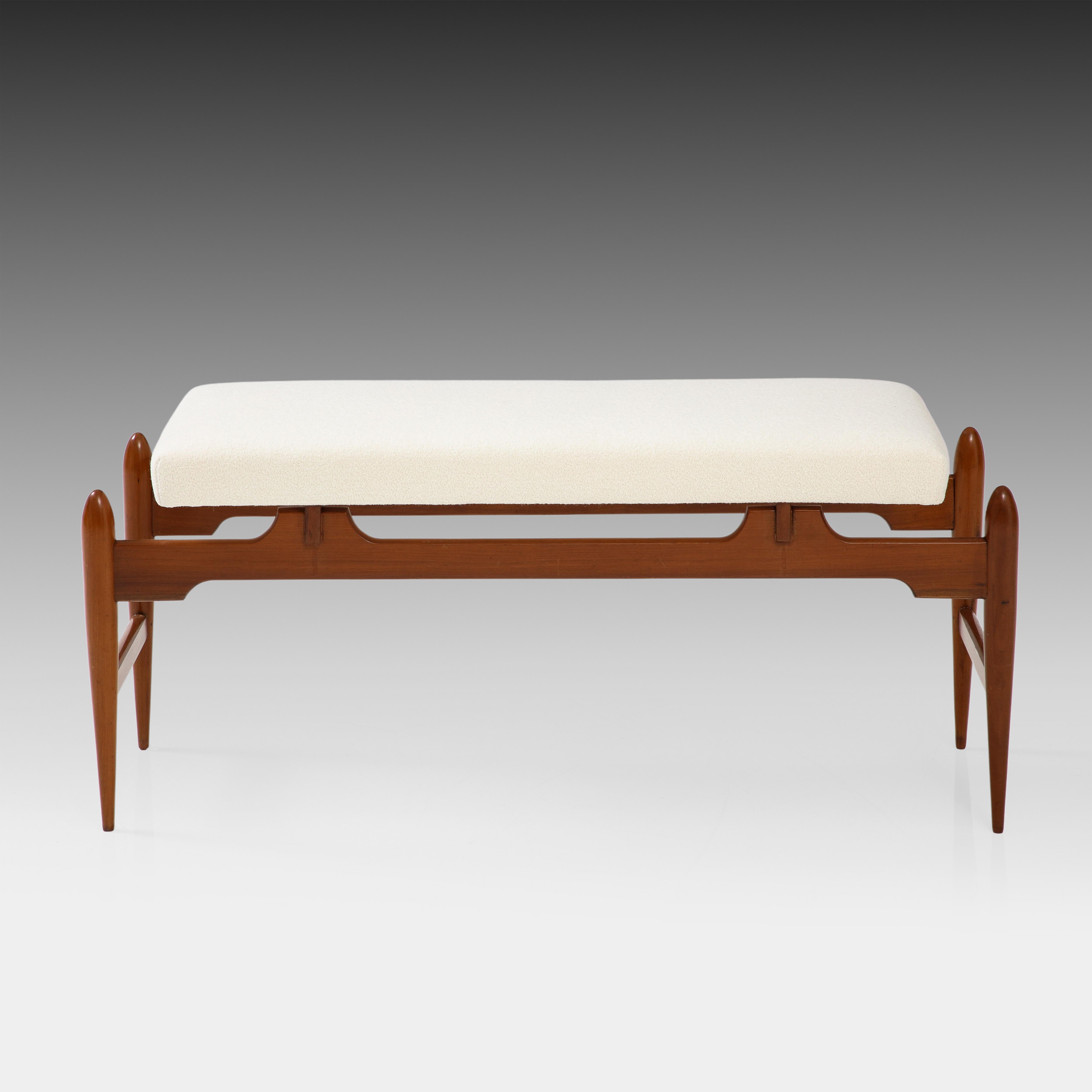 Italian modernist bench with clean architectural lines on sculptural wood frame and upholstered cushion seat.  
Fully restored and newly upholstered in a luxurious Holland & Sherry Brunswick Snow or ivory bouclé.