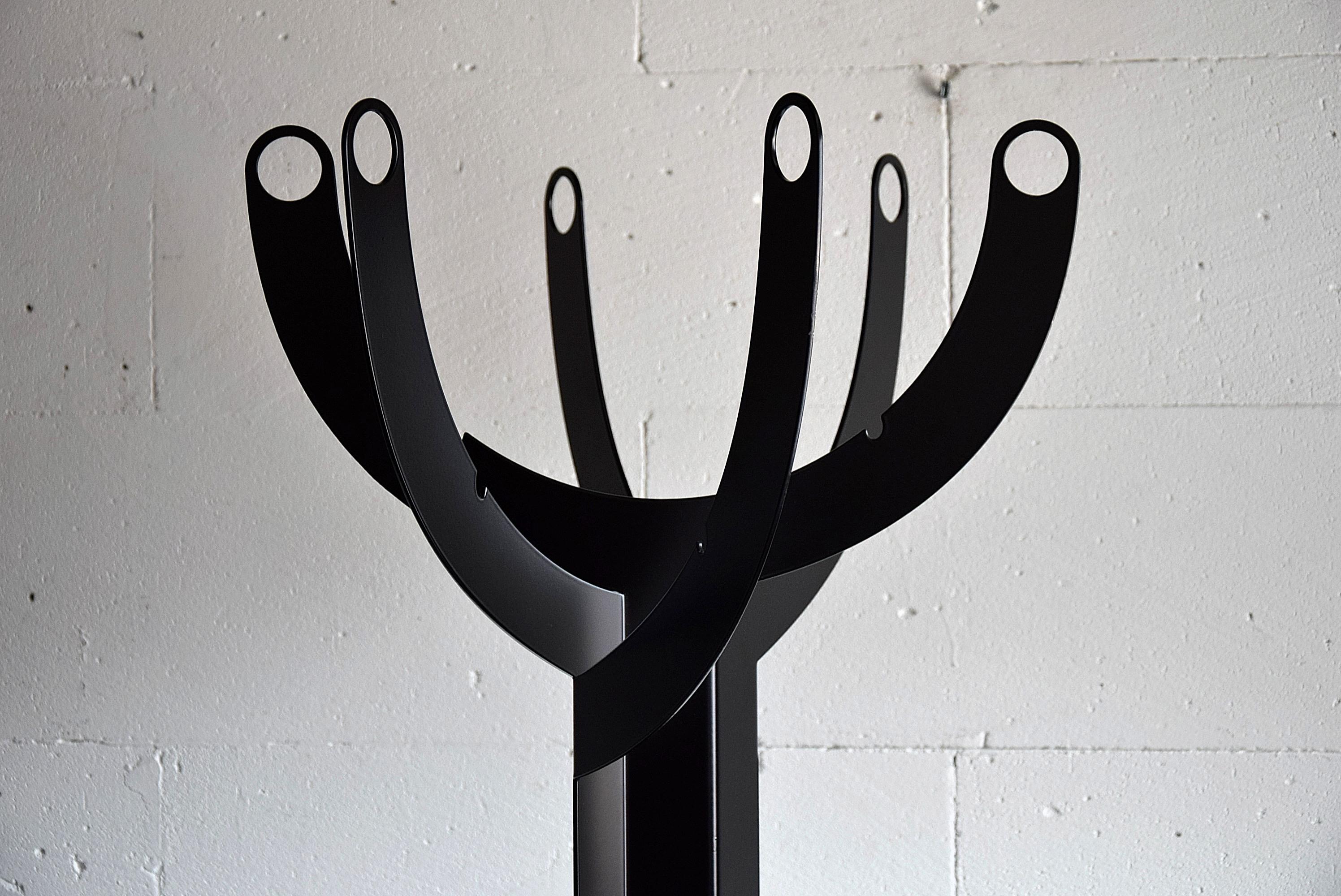 Modernist Italian black powder coated metal coat stand in perfect condition.
This sculptural piece will be shipped insured overseas in a custom made wooden crate. Cost of insured transport is crate included.