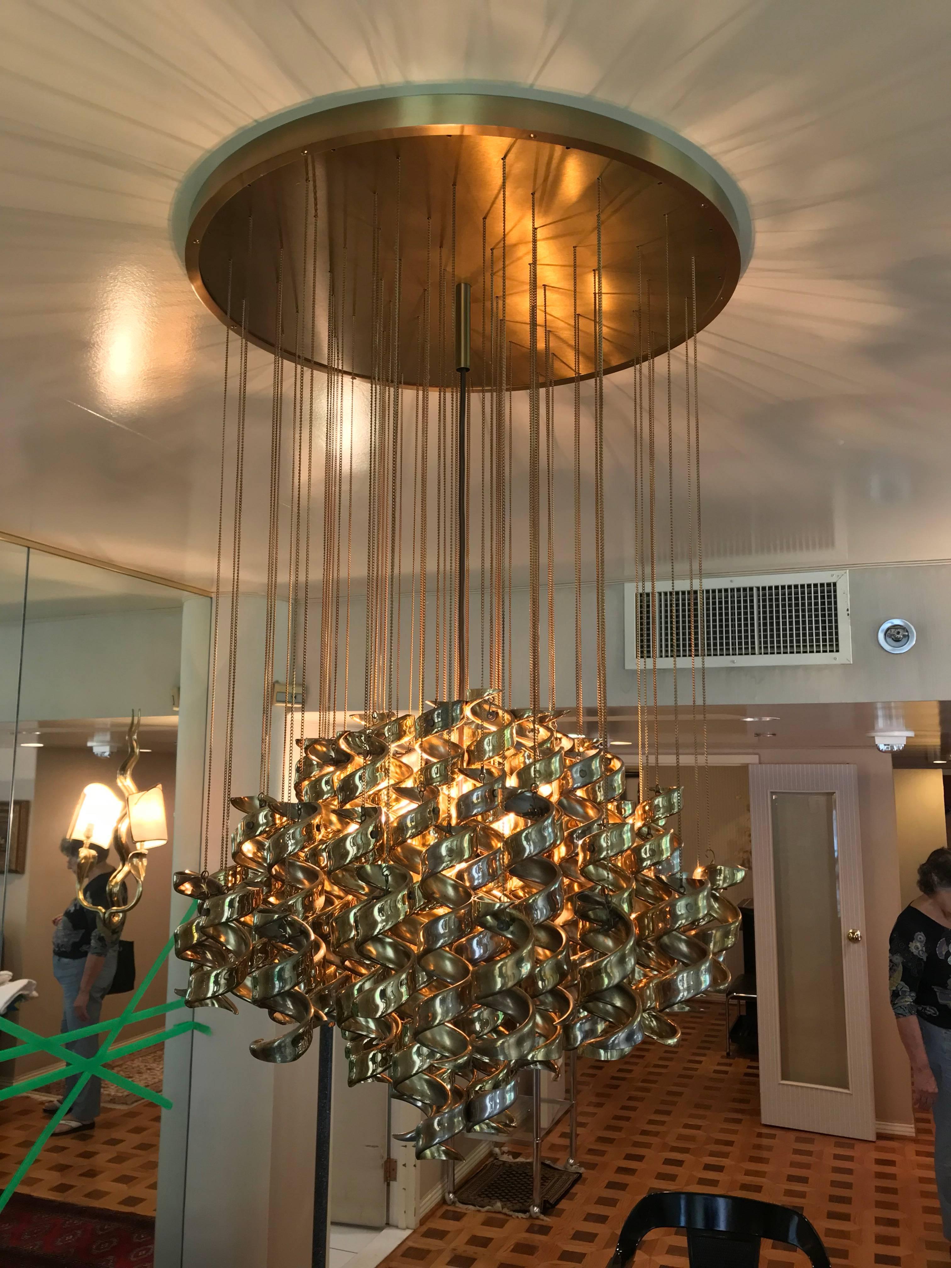 Italian modernist brass hanging curls chandelier.