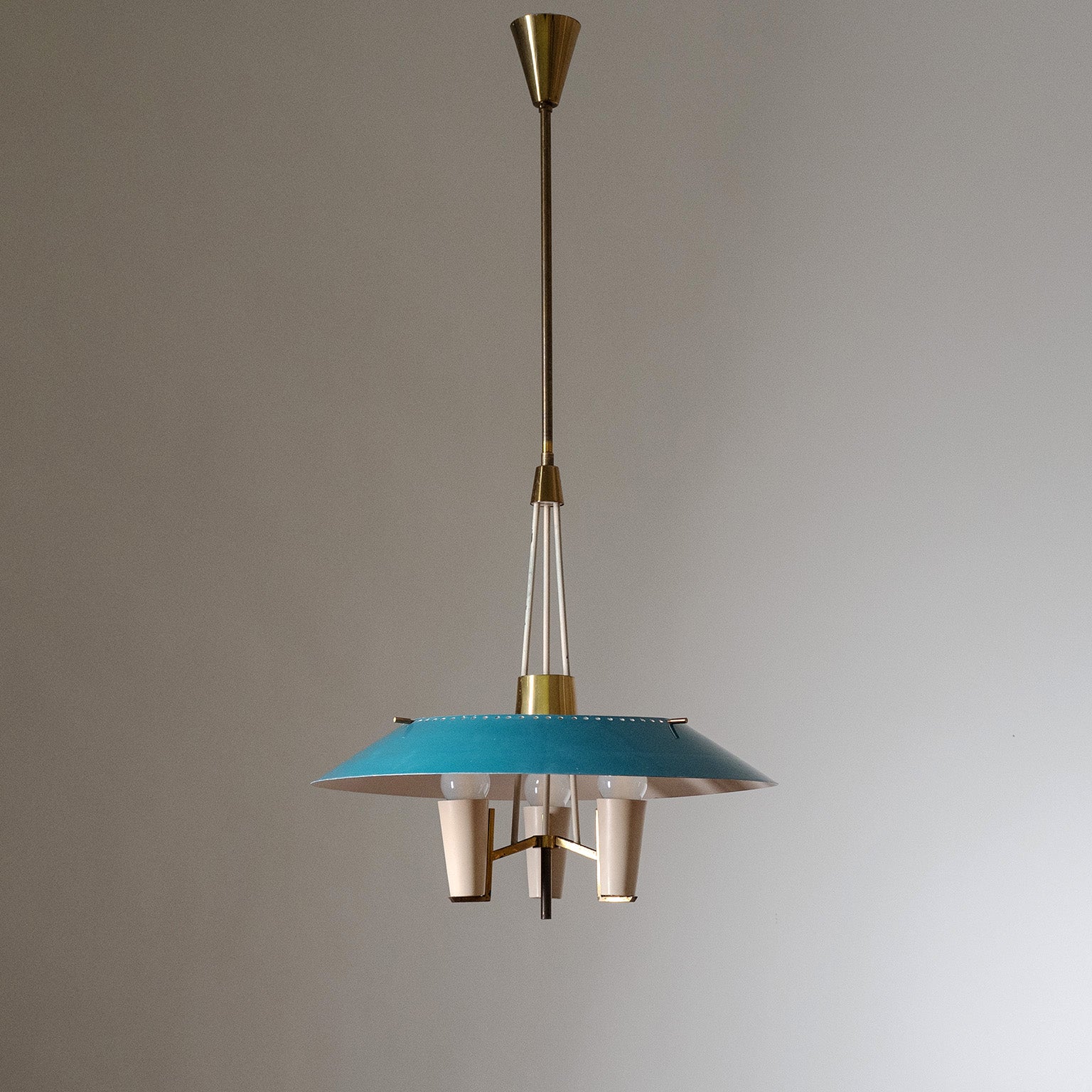Rare modernist Italian chandelier/lantern from the 1950s. Sculptural brass structure with a large lacquered aluminum shade. Nice condition with patina on the brass and some light wear to the original lacquer. Three original brass E14 sockets with