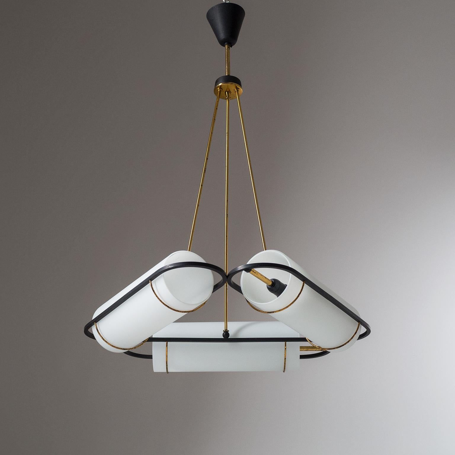 Very rare Italian modernist chandelier attributed to Stilnovo from the 1950s. Three arms arranged in triangular form, each with a large acid-satinated glass diffuser and an original E14 socket with new wiring. Very good original condition with