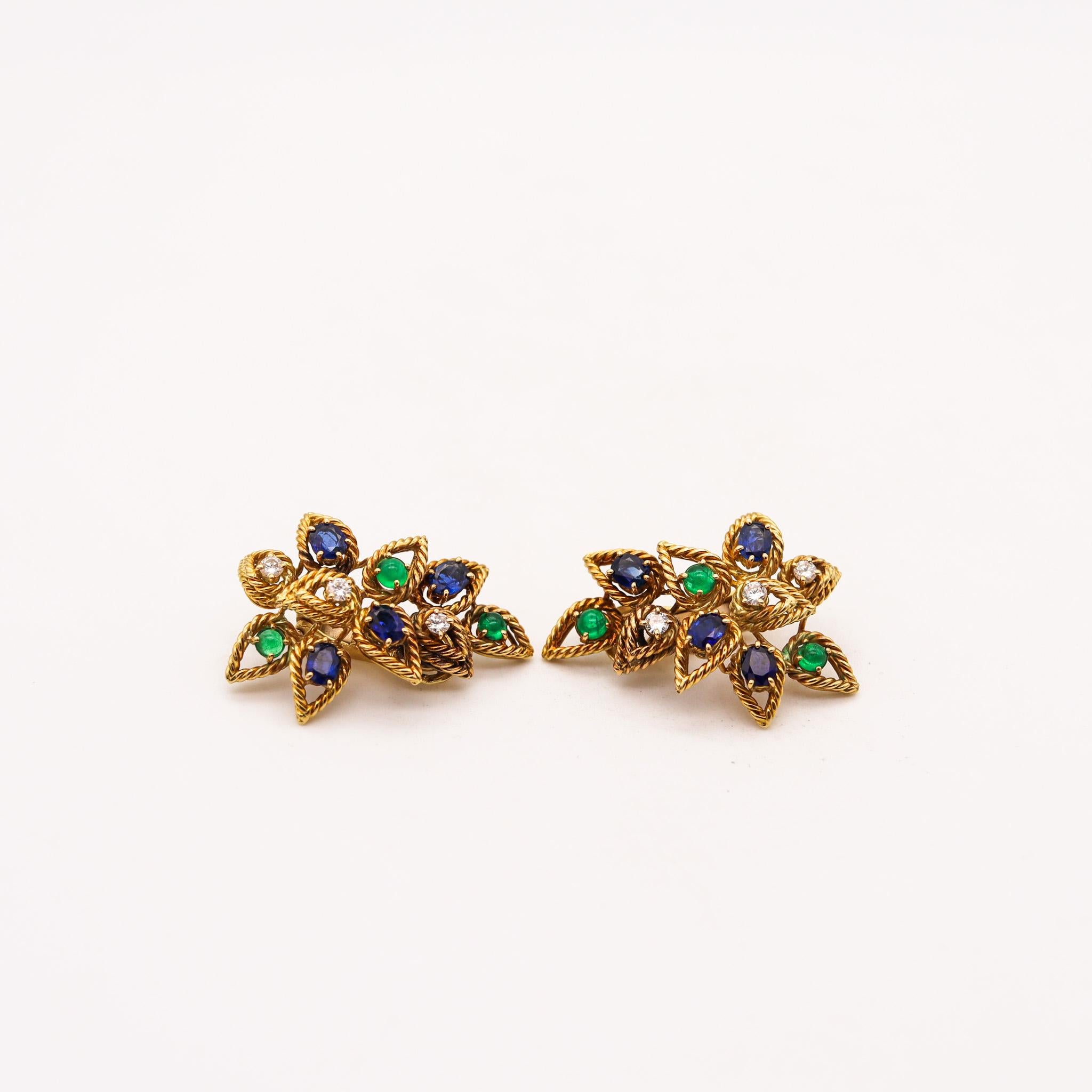 Cocktail ear clips with natural gemstones.

Very beautiful and colorful pair of modernists ear clips, created in Italy back in the late 1960's. They was carefully crafted with twisted wires made up in solid yellow gold of 18 karats, with textured