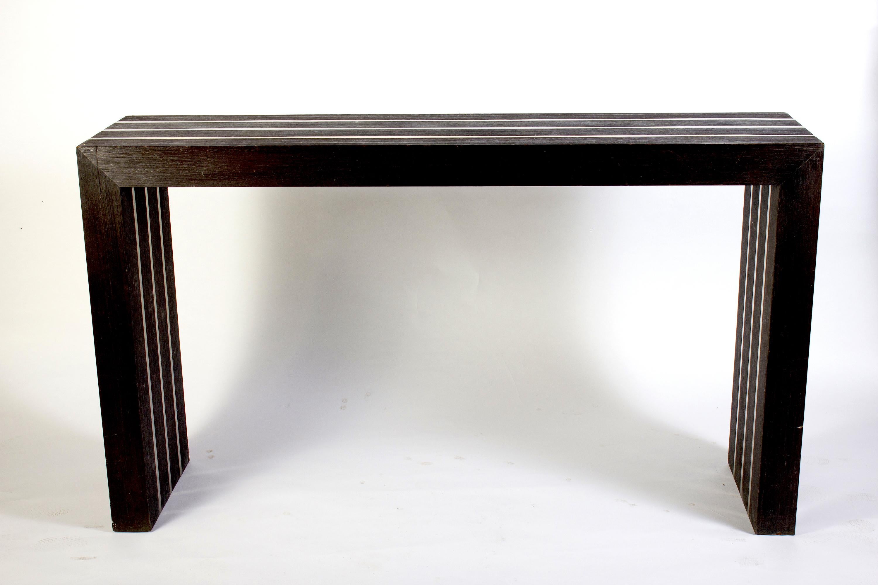 Italian modernist dark wood and steel insert console table.
  