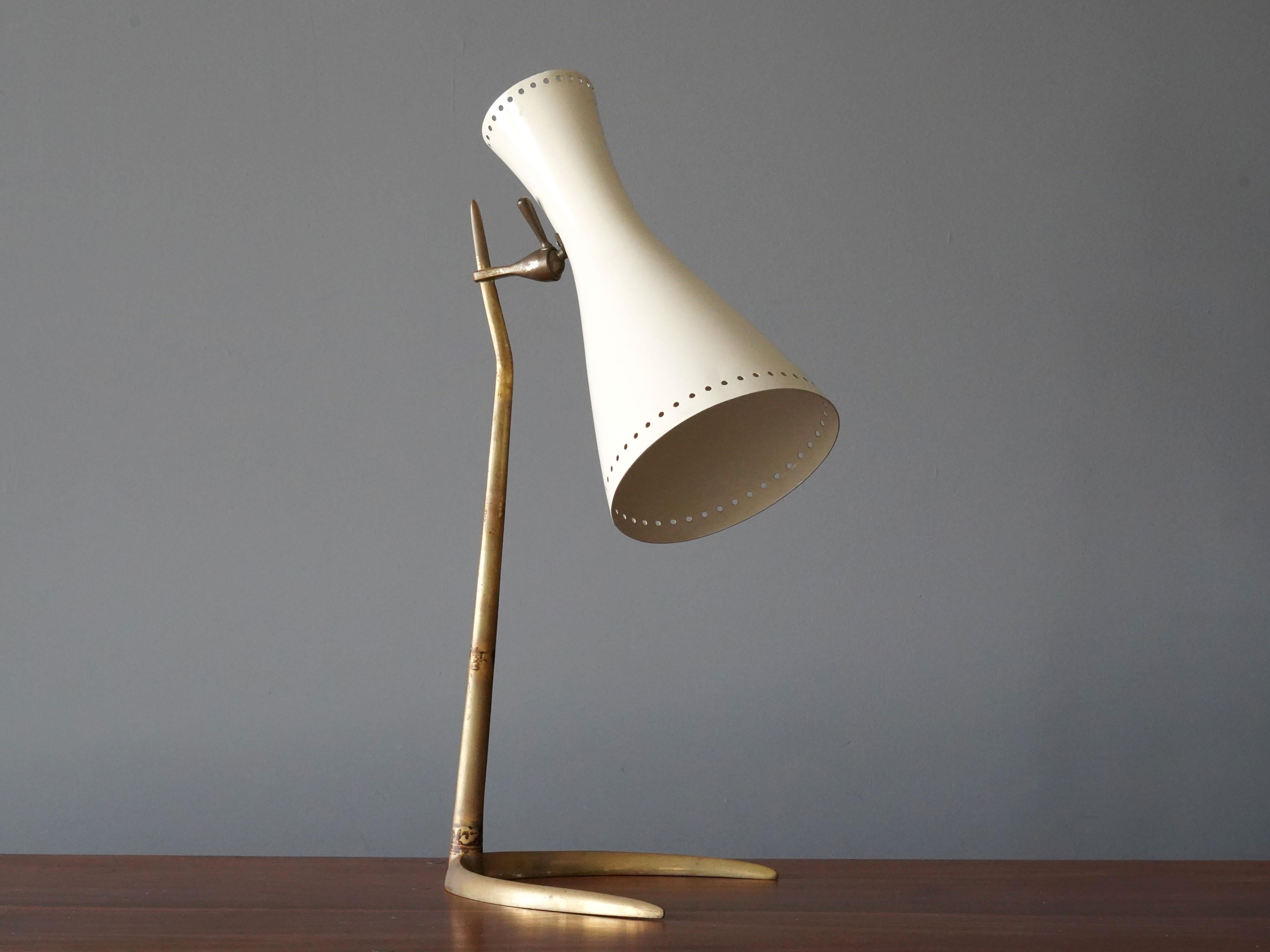 A highly modernist table lamp / desk light. Designed by an unknown Italian designer. Produced in Italy, 1950s. Features a sculpted brass base, perforated lacquered metal screen. 

Other Italian lighting designers of the period include Angelo