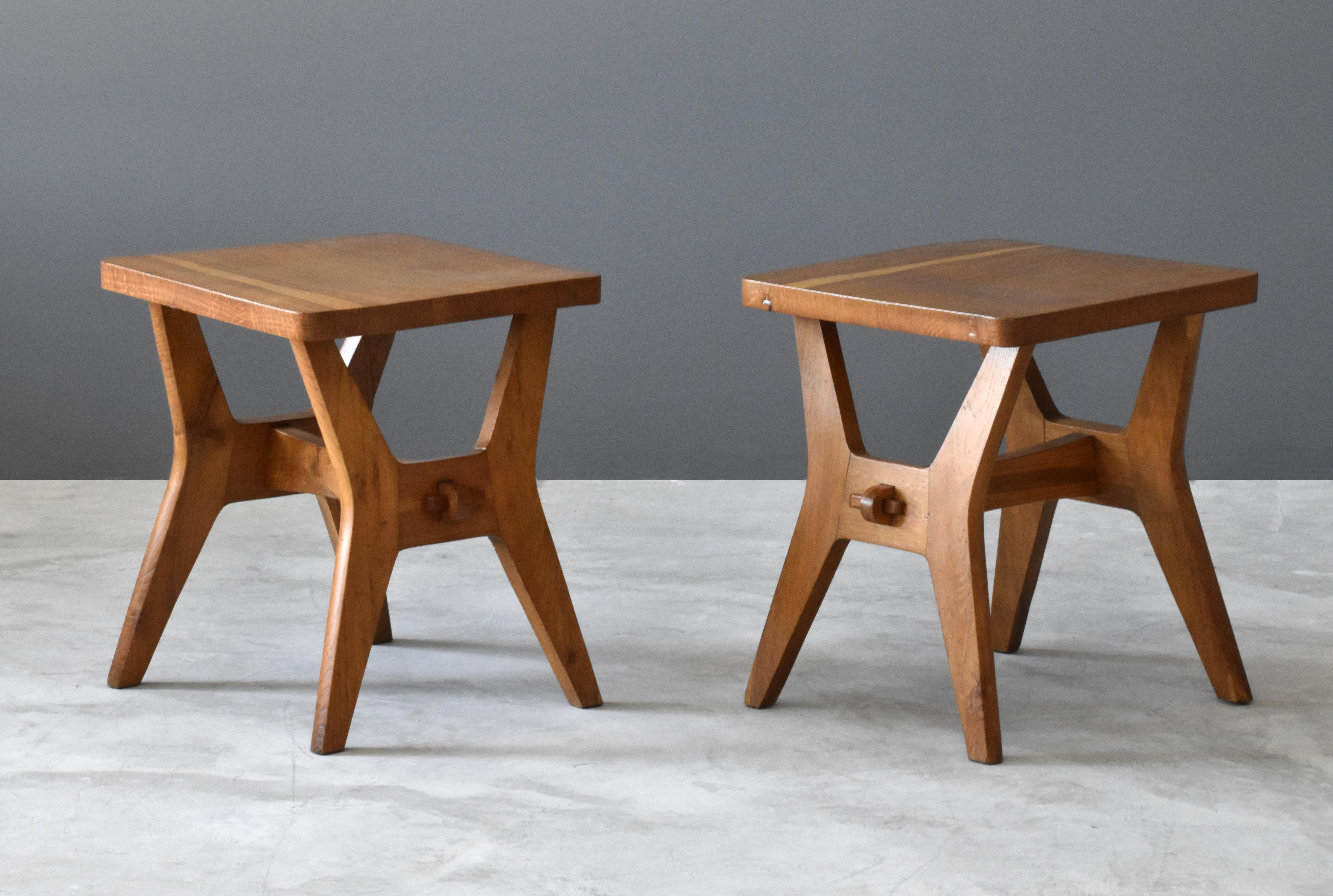 A pair of highly modern oak stools, with refined form and revealed joinery.  Designed by unknown Italian designer, most likely produced in Milan. 

