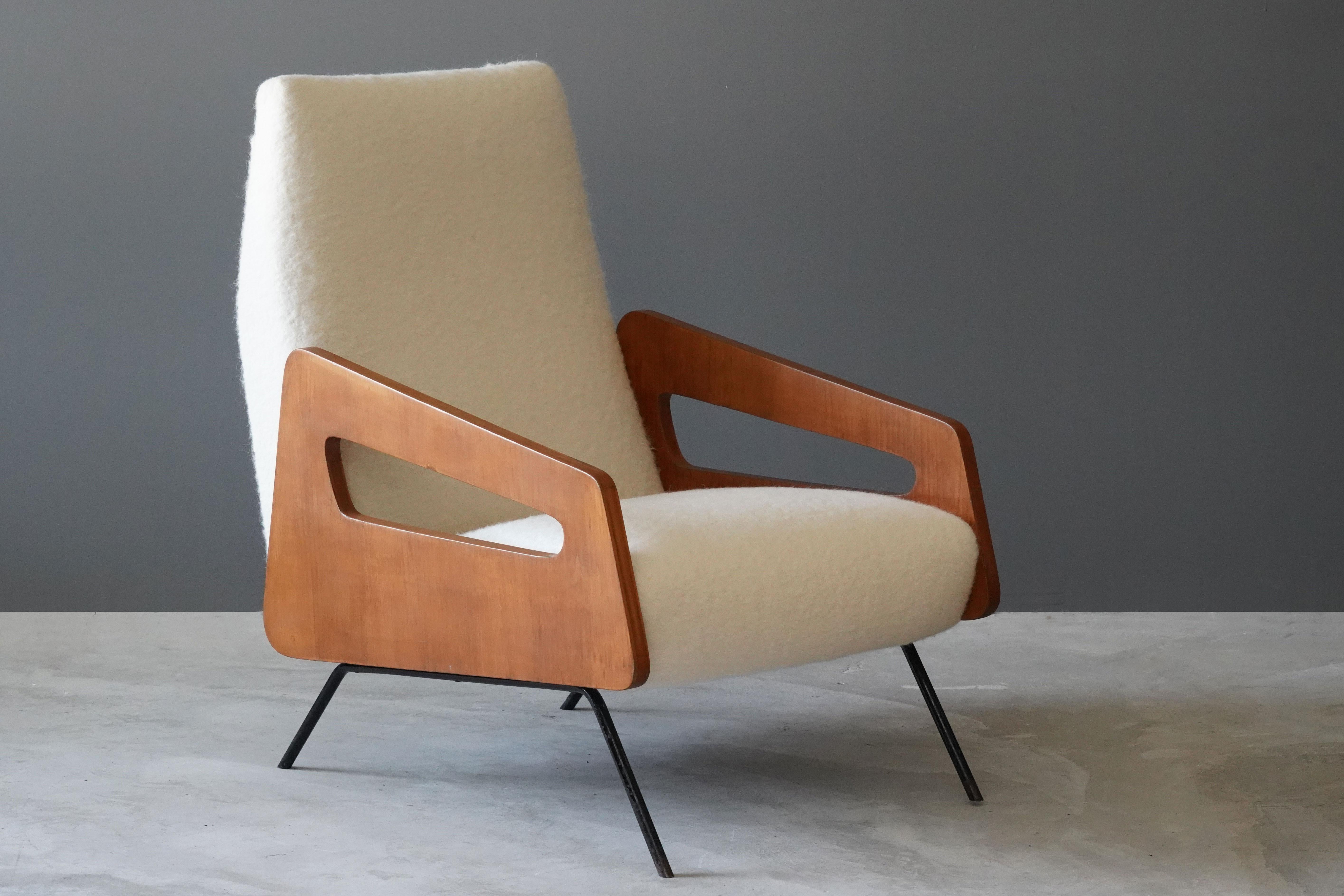 A pair of highly modernist lounge chairs. Designed and produced in Italy, 1950s. Features an interesting mix of materials, brand-new white high-end bouclé, wood, and lacquered steel.

Other designers of the period include Gio Ponti, Franco Albini,