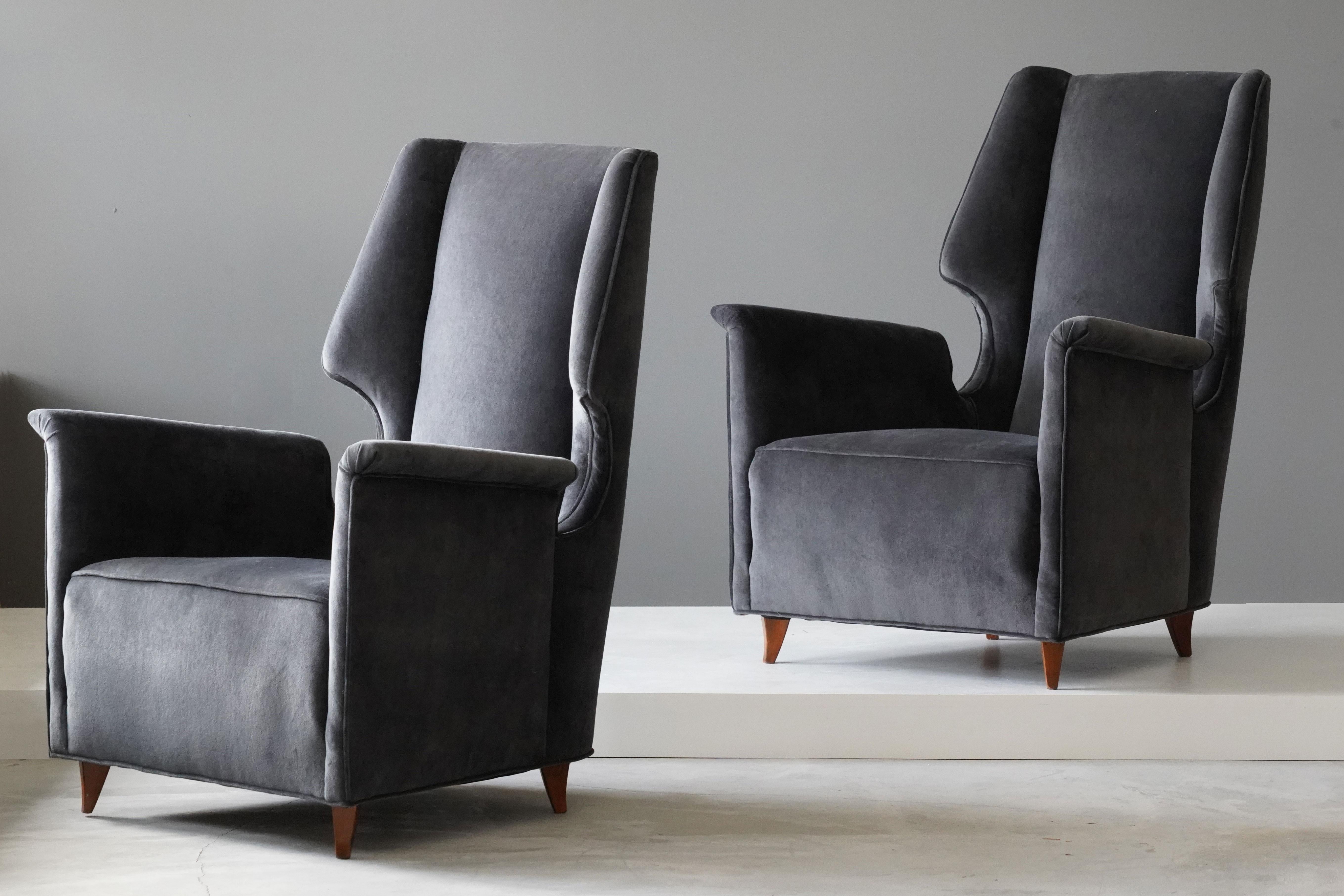 A pair of lounge chairs designed by an unknown Italian modernist designer, 1950s, Italy. Upholstered in new high-end velvet.

Other Italian designers of the period include Gio Ponti, Franco Albini, Paolo Buffa, Carlo Mollino, and Ico Parisi.